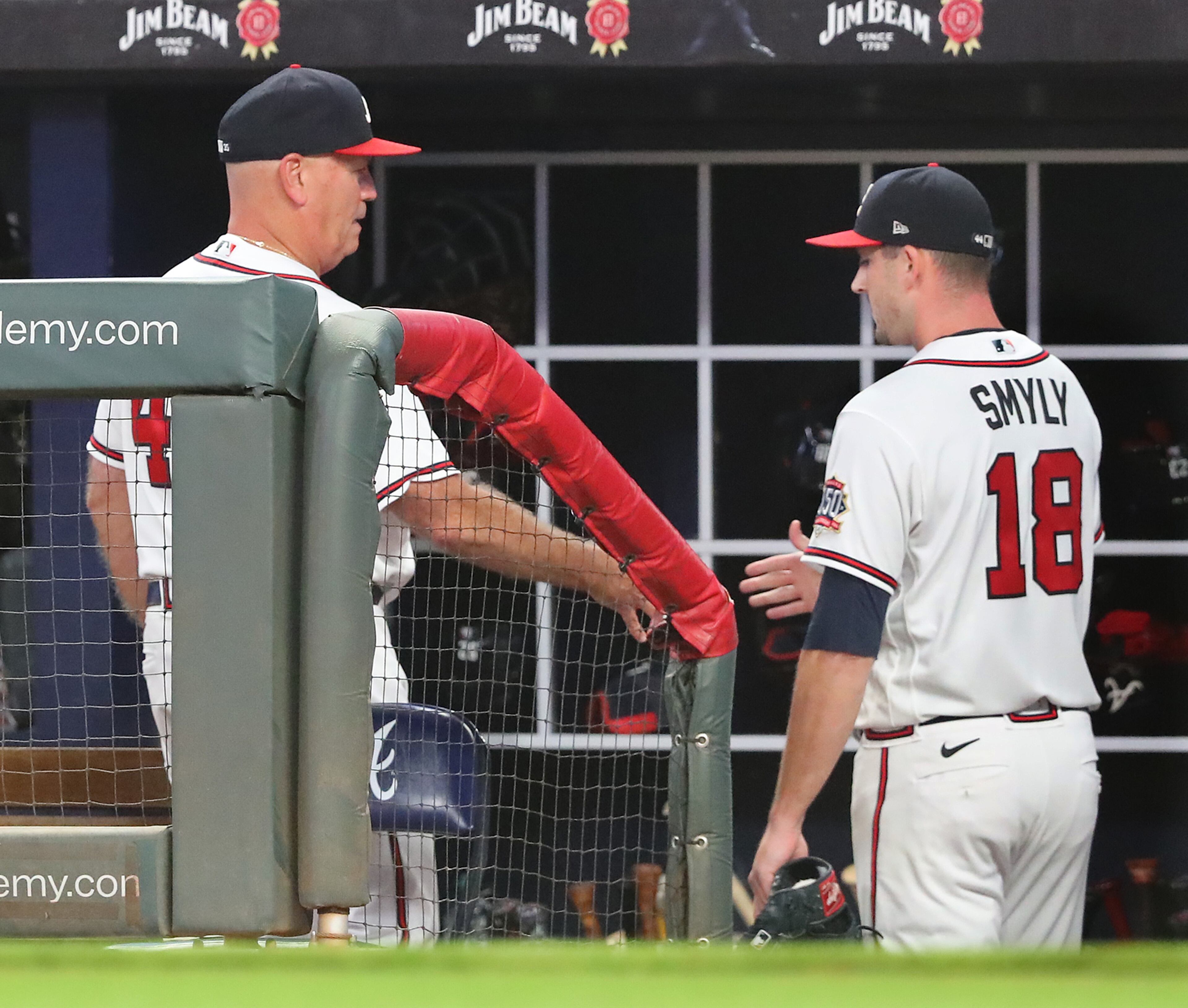 Braves manager Brian Snitker gives starting pitcher Drew Smyly five after he goes six innings against the Cincinnati Reds in a MLB baseball game on Tuesday, August 10, 2021, in Atlanta. “Curtis Compton / Curtis.Compton@ajc.com”