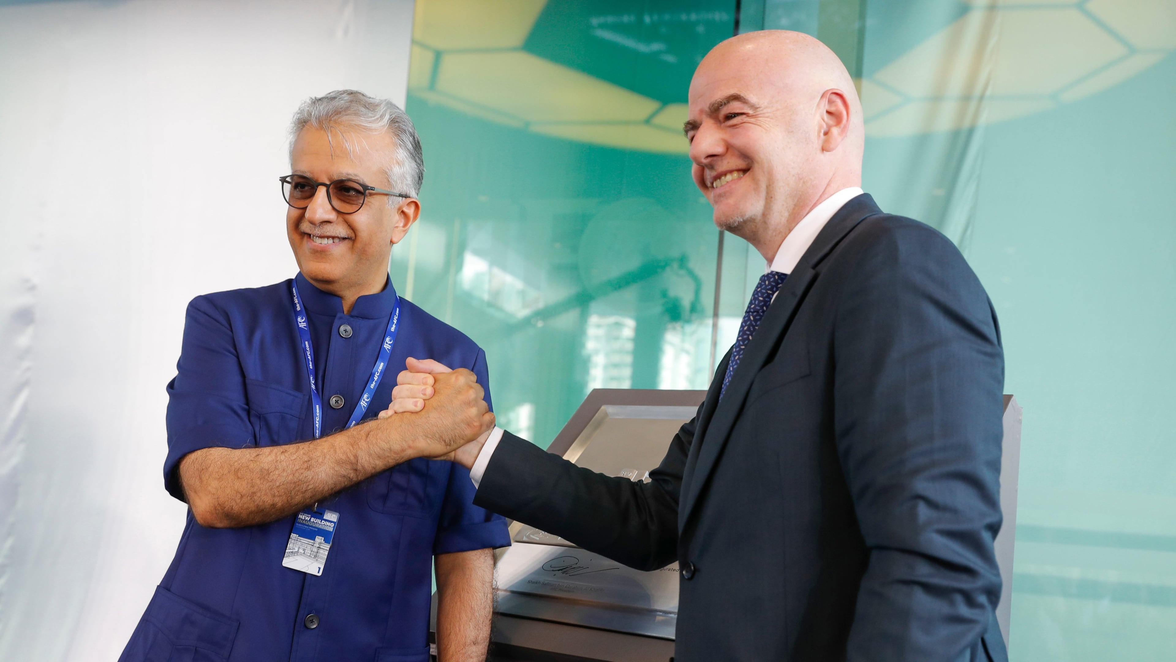 FILE - Asia Football Confederation President Salman Bin Ibrahim Al-Khalifa, left, poses with FIFA President Gianni Infantino during an inauguration ceremony for the new building of the Asia Football Confederation in Kuala Lumpur, Malaysia Tuesday, Oct. 30, 2018. (AP Photo/Vincent Thian, File)
