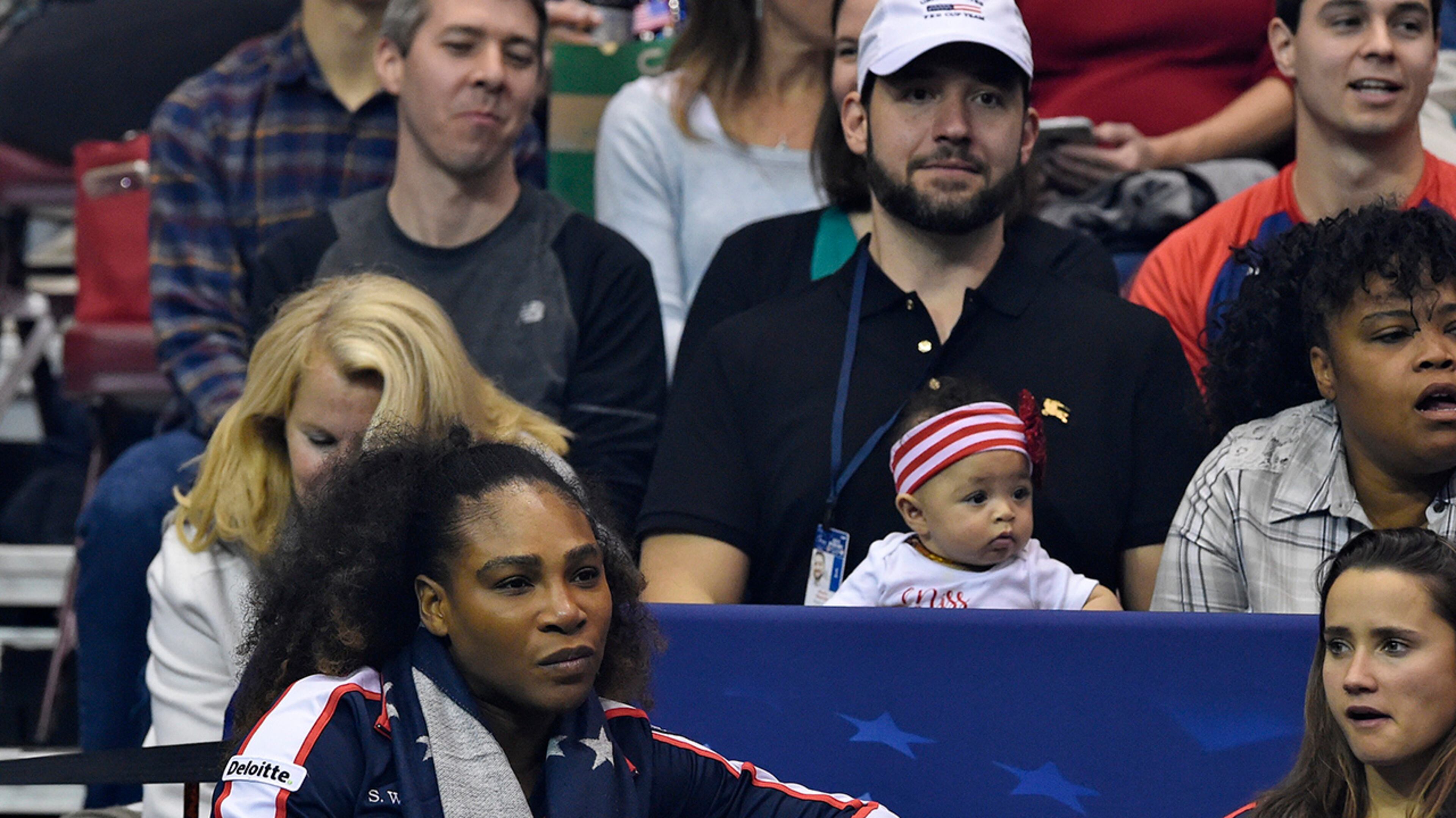 ASHEVILLE, NC - FEBRUARY 10: Serena Williams of Team USA, bottom left, along with her husband Alexis Ohanian and their daughter Alexis Olympia, center, watch the action during the first round of the 2018 Fed Cup at US Cellular Center on February 10, 2018 in Asheville, North Carolina. (Photo by Richard Shiro/Getty Images)