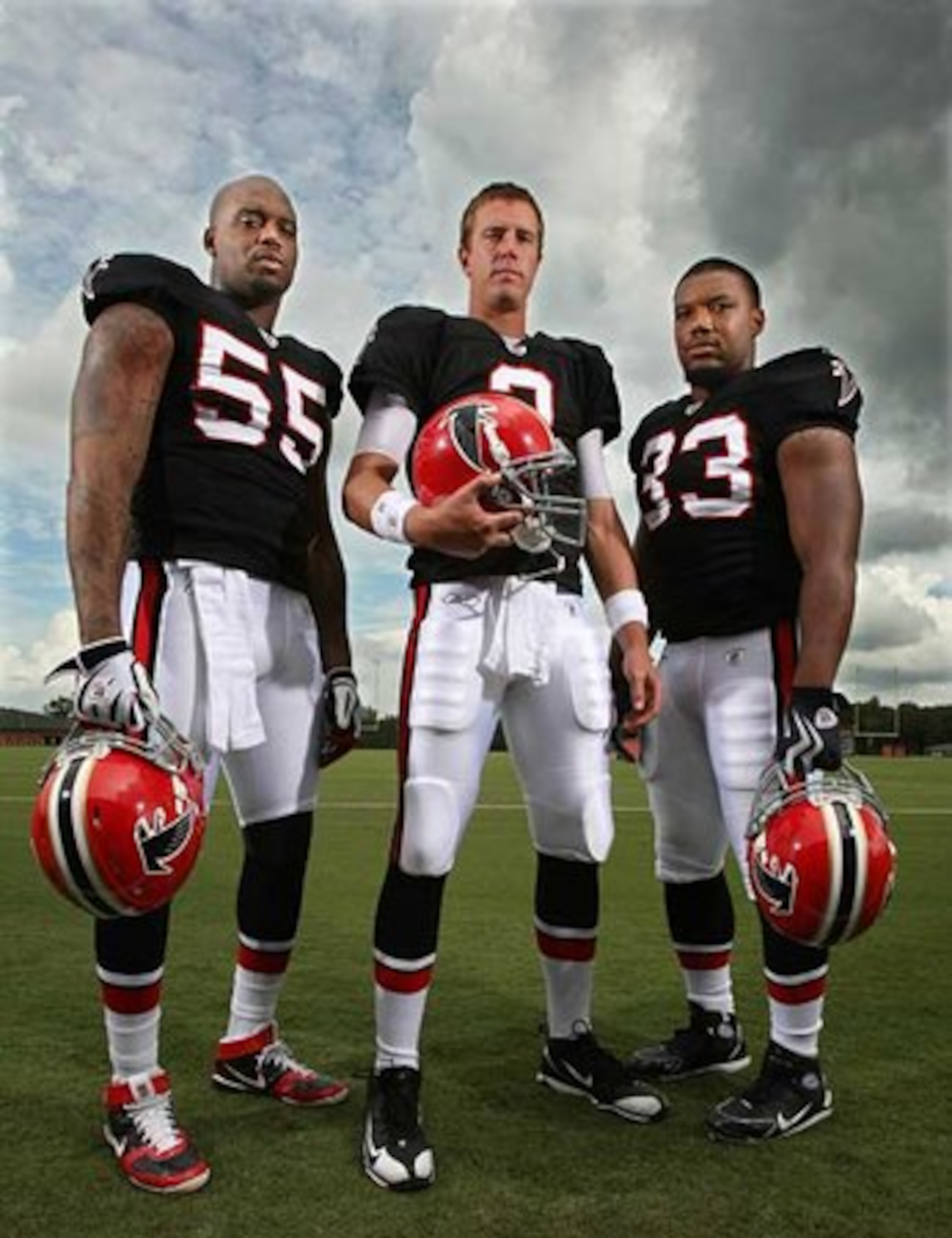 BACK IN BLACK: DE John Abraham, QB Matt Ryan and RB Michael Turner (left to right) model the 1966 throwback uniforms the Falcons will wear in the second game of the season vs. the Carolina Panthers and in the November 29 game vs. the Buccaneers.