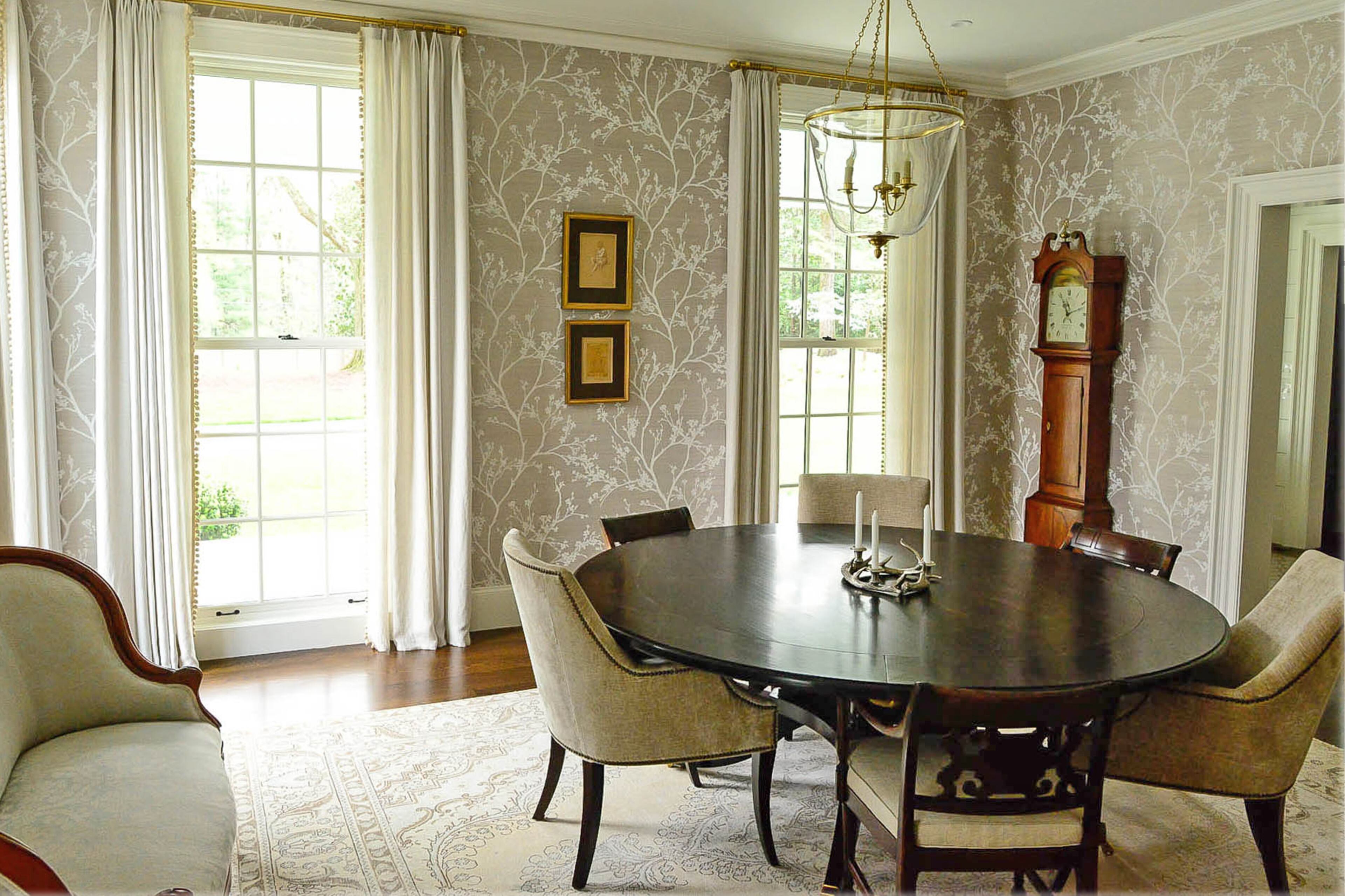 The wallpaper was a last-minute decision that Ellen Turner loves because of the dimension it adds to her dining room. Other details include the nailhead trim on the chairs.