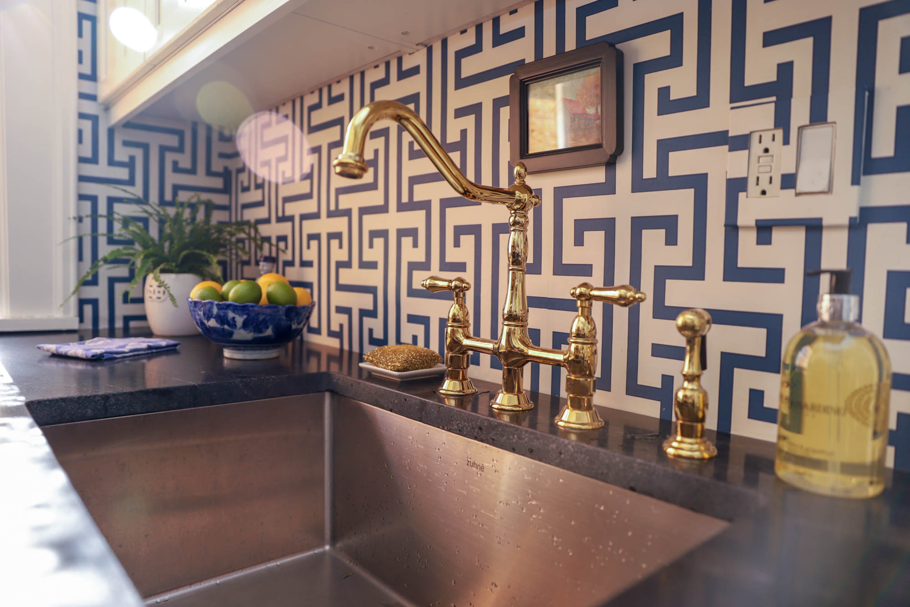 Wallpaper from Thibaut adds a youthful twist to the classic blue-and-white kitchen.
