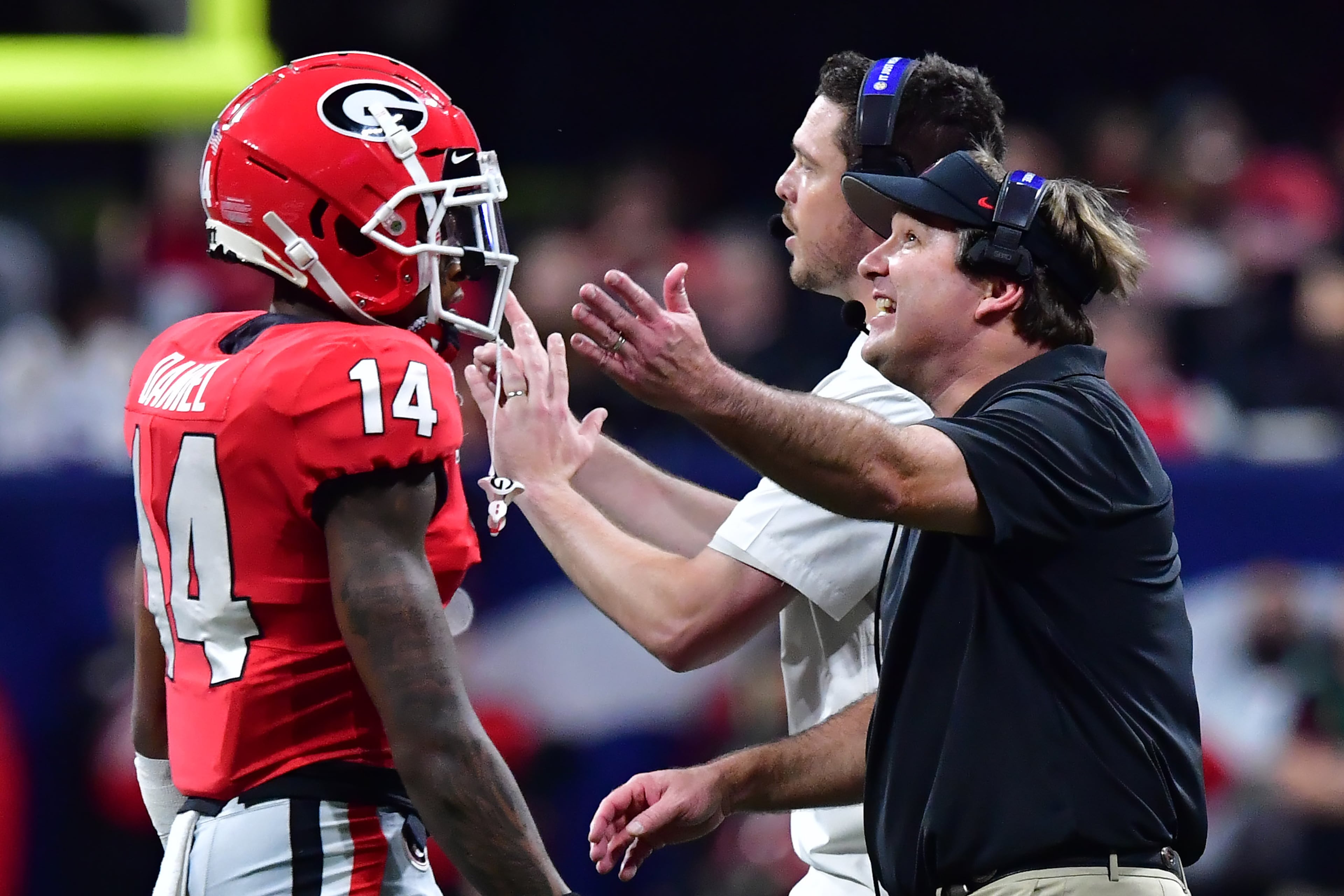 Georgia Bulldogs head coach Kirby Smart reacts as defensive back DJ Daniel (14) leaves the field during the first half of the Georgia vs. LSU SEC Football Championship game at Mercedes-Benz Stadium in Atlanta. Hyosub Shin / hyosub.shin@ajc.com
