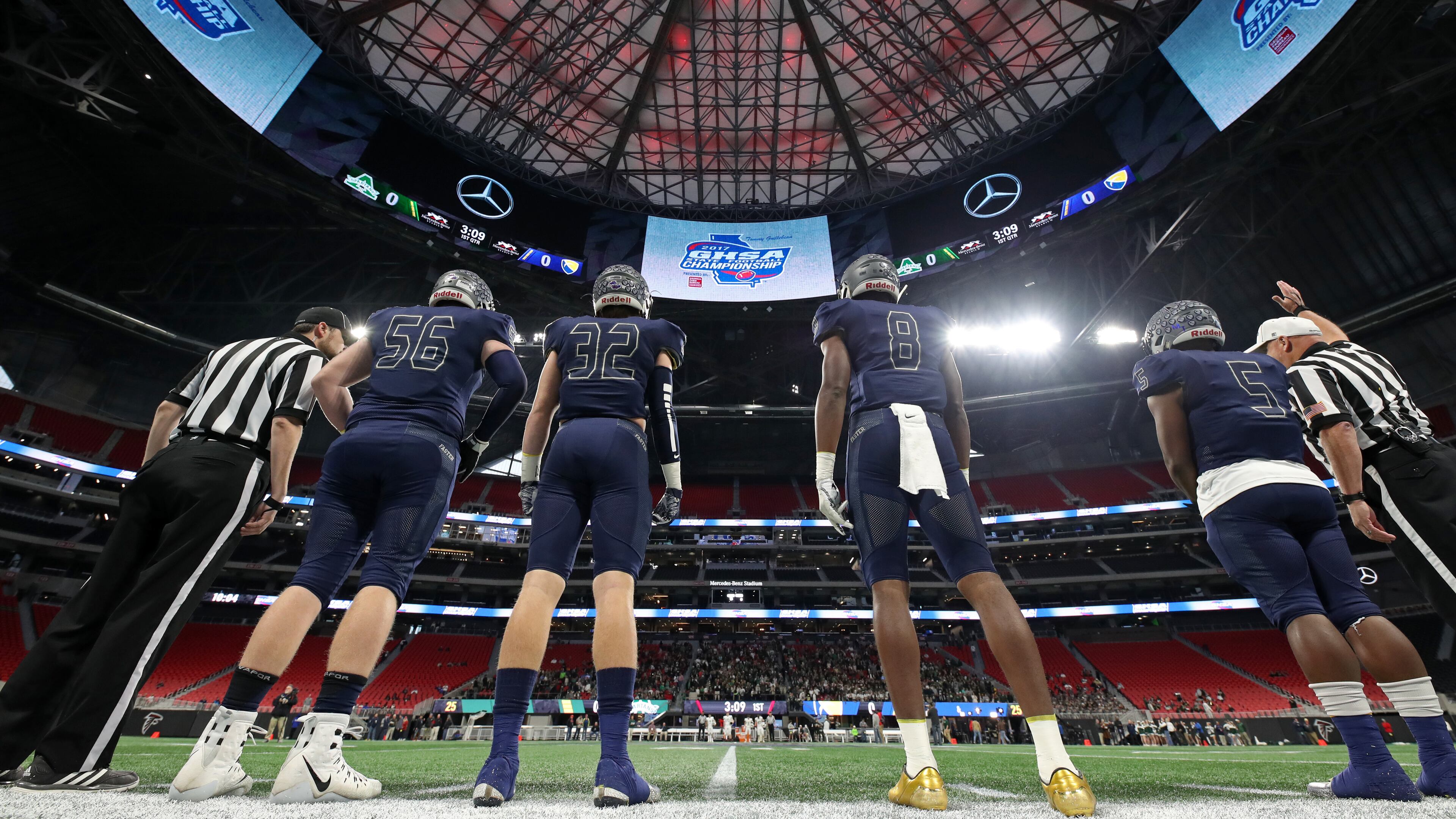 Eagle's Landing Christian captains Zack Jones (56), George Shockley (32), Tre' Douglas (8) and Josh Mays (5) lines up for the coin toss before their game against Athens Academy during the Class A Private Championship at Mercedes-Benz Stadium Friday, December 8, 2017 in Atlanta.