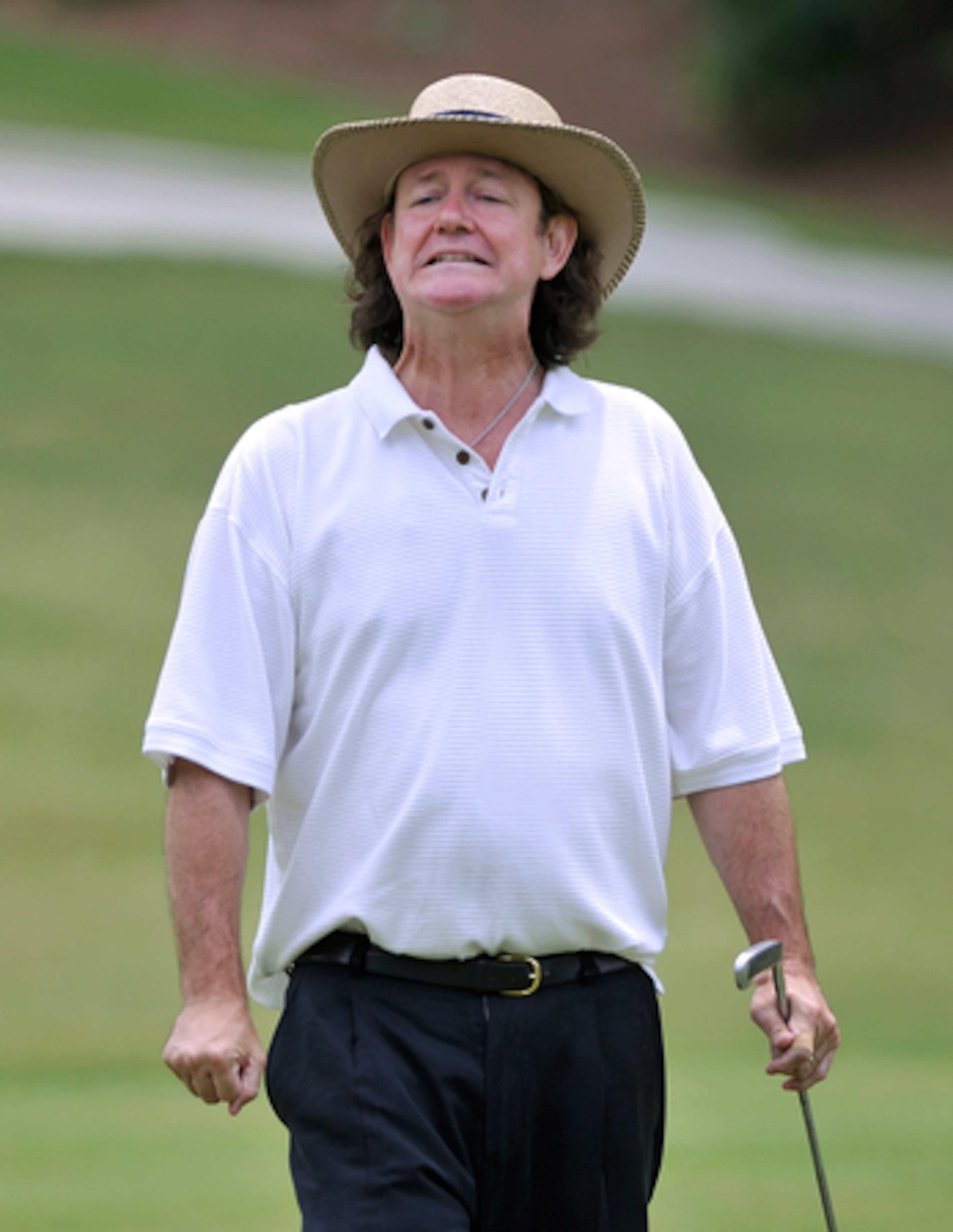 Bell reacts to a putt that had too much zip. As a teenager, "I had to climb a few trees to get" back his putter, he says of the times he launched the club in disgust, but after his extended break, he found music had erased his golf ego.