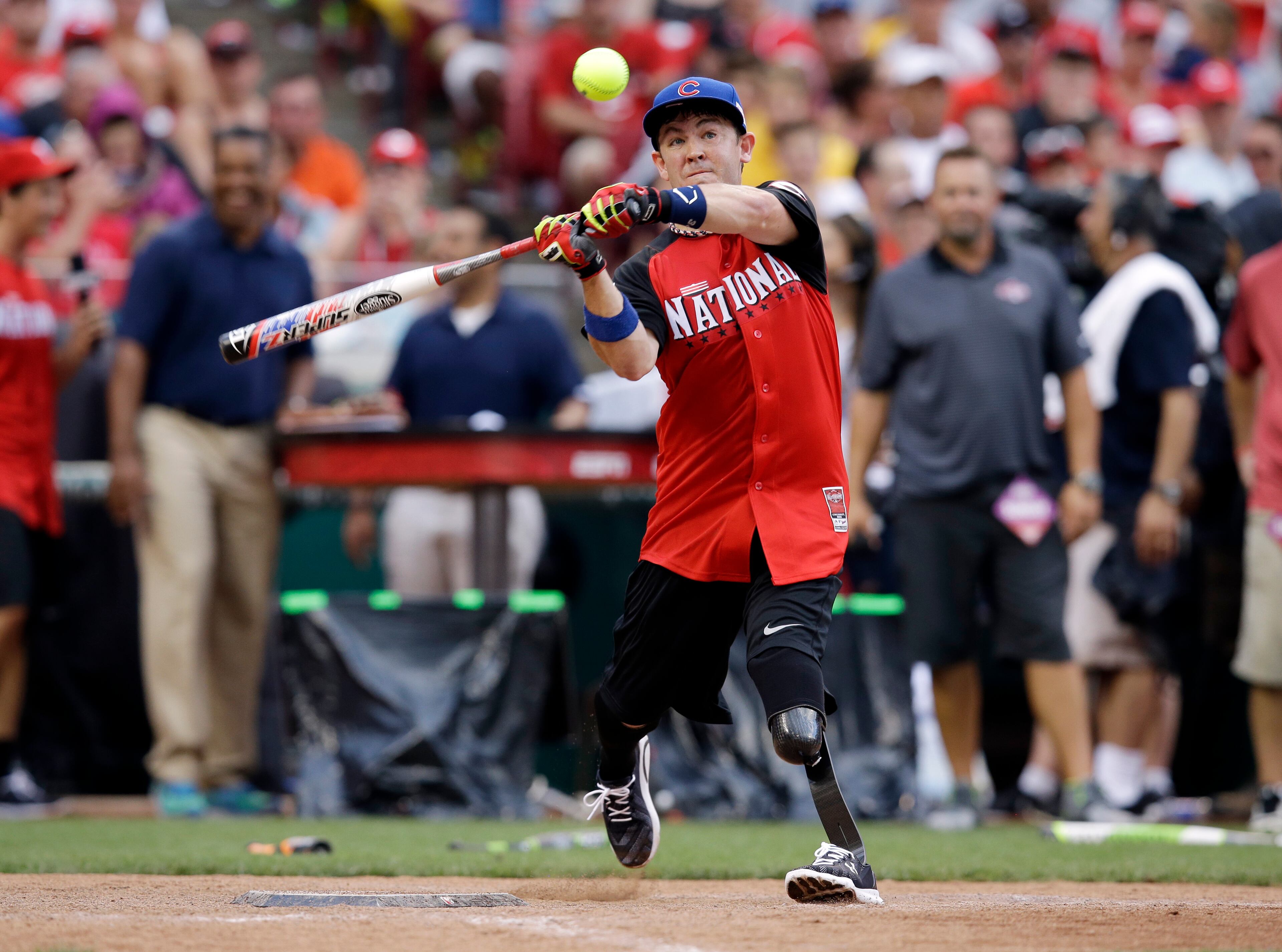 Tim Horton hits during the All-Star Legends & Celebrity Softball game, Sunday, July 12, 2015, in Cincinnati. (AP Photo/John Minchillo)