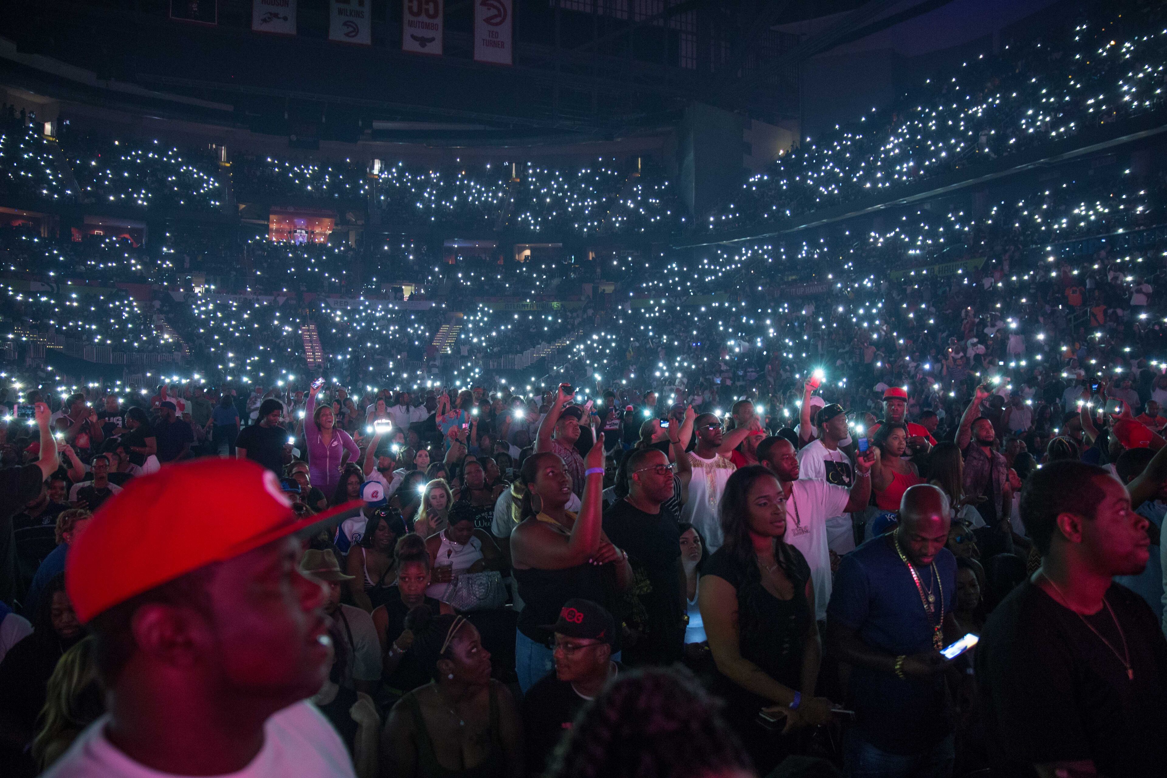 Fans hold up their phones during the Hot 107.9 "Birthday Bash 21" at Philips Arena on Saturday, June 18, 2016, in Atlanta. BRANDEN CAMP/SPECIAL
