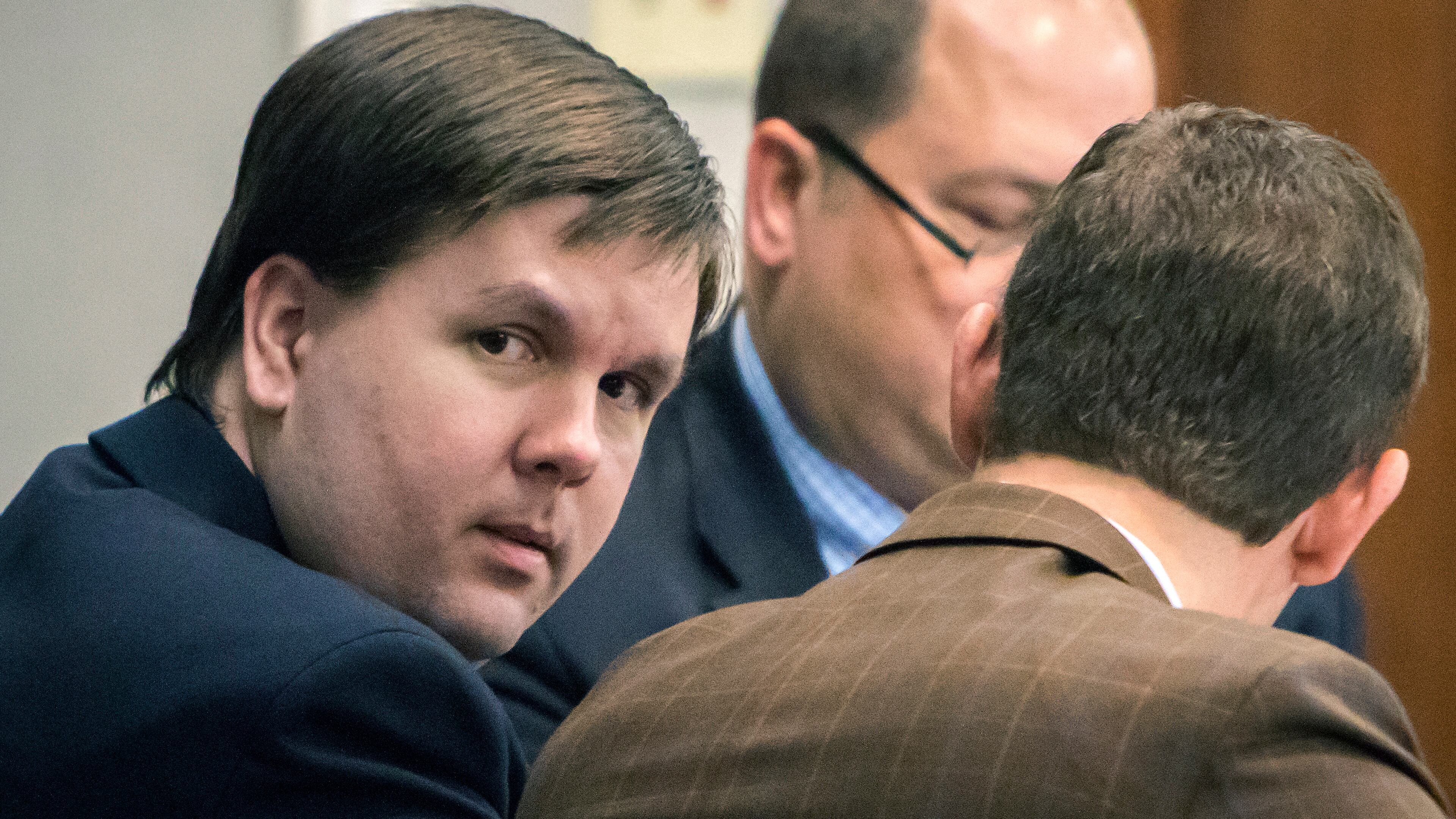 Justin Ross Harris speaks with attorney Carlos Rodriguez in the courtroom during his murder trial, Thursday, Nov. 10, 2016, in Brunswick, Ga. (Stephen B. Morton/Atlanta Journal-Constitution via AP, Pool)