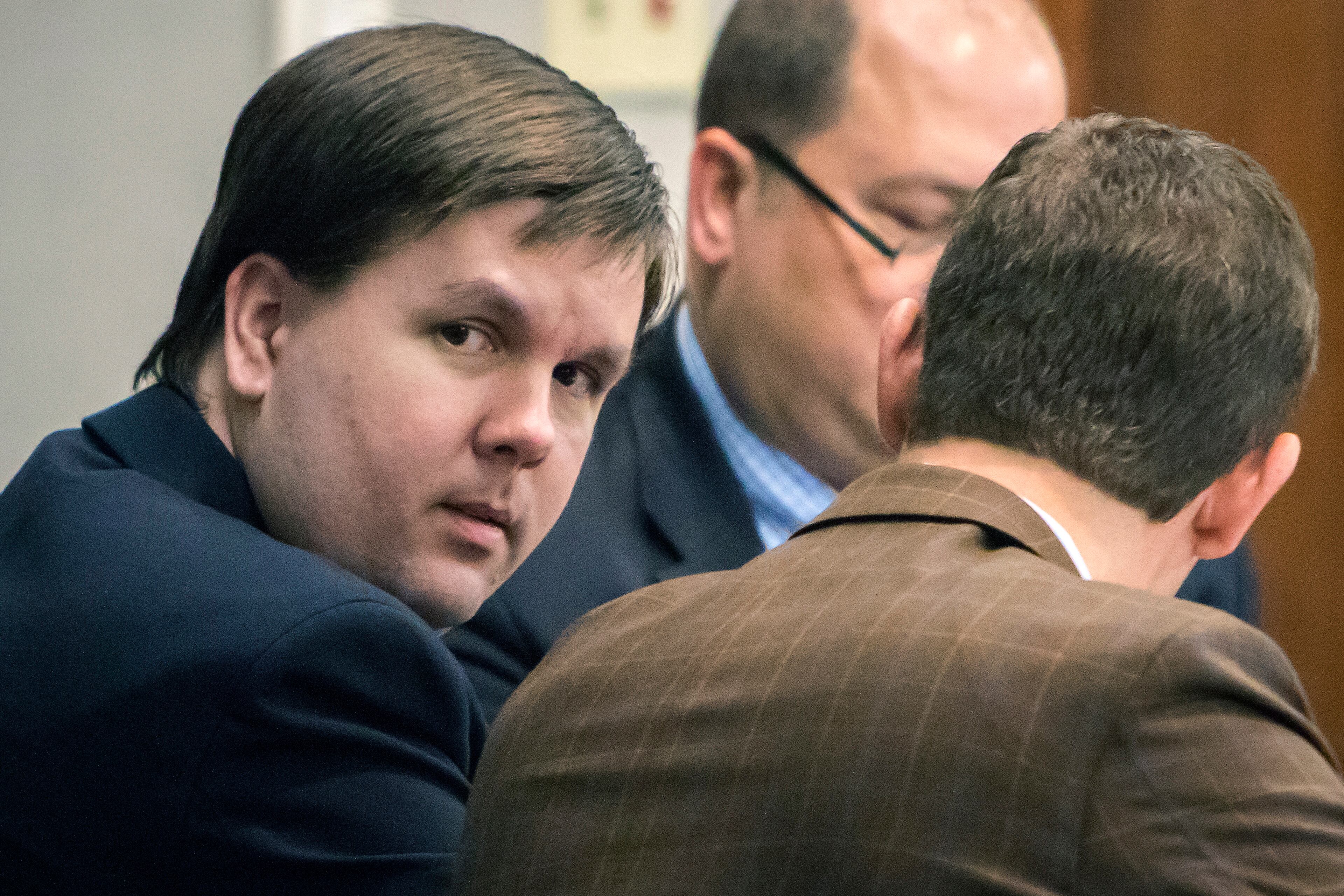 Justin Ross Harris speaks with attorney Carlos Rodriguez in the courtroom during his murder trial, Thursday, Nov. 10, 2016, in Brunswick, Ga. (Stephen B. Morton/Atlanta Journal-Constitution via AP, Pool)