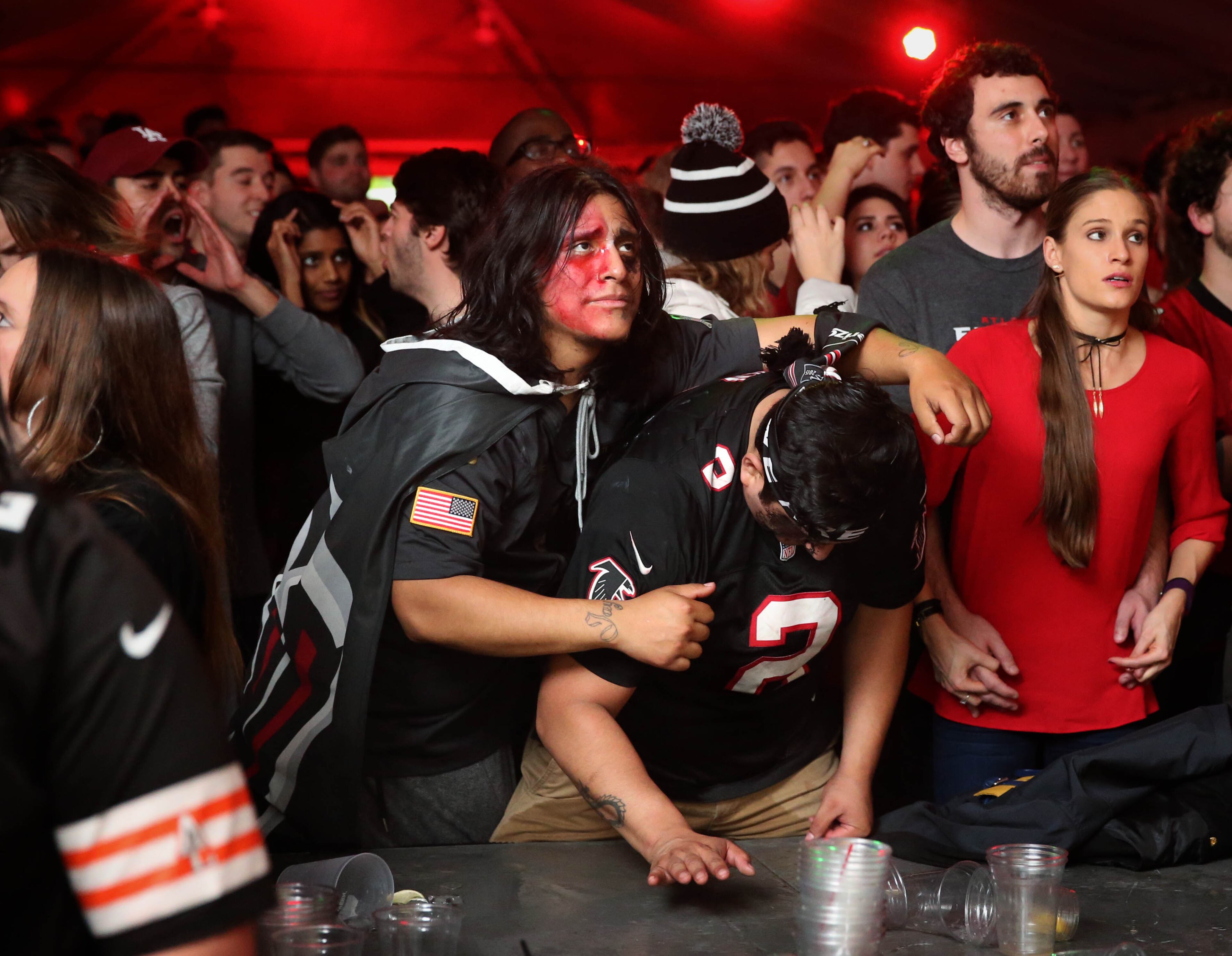 February 5, 2017 - Atlanta, Ga: Atlanta Falcons fans Jason Solis, left, and John Vergalejo react to a missed third down by the Atlanta Falcons in the fourth quarter of the Super Bowl 51 at Park Tavern Sunday February 5, 2017, in Atlanta. The Falcons lost to the Patriots 34-28 in overtime. PHOTO / JASON GETZ