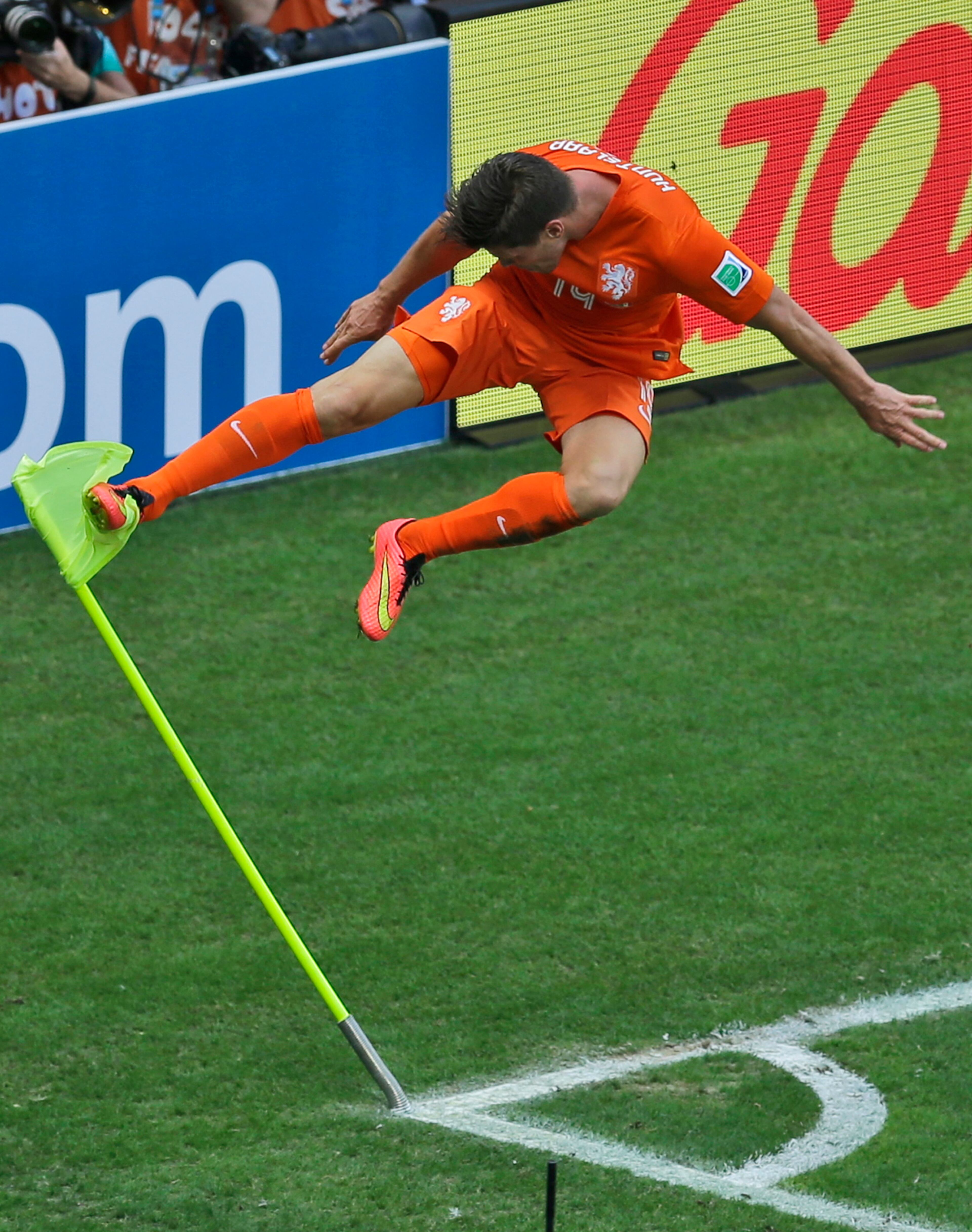 Netherlands' Klaas-Jan Huntelaar celebrates after scoring his side's second goal from the penalty spot during the World Cup round of 16 soccer match between the Netherlands and Mexico at the Arena Castelao in Fortaleza, Brazil, Sunday, June 29, 2014. Holland won 2-1 and advanced to the quarterfinal. (AP Photo/Themba Hadebe)