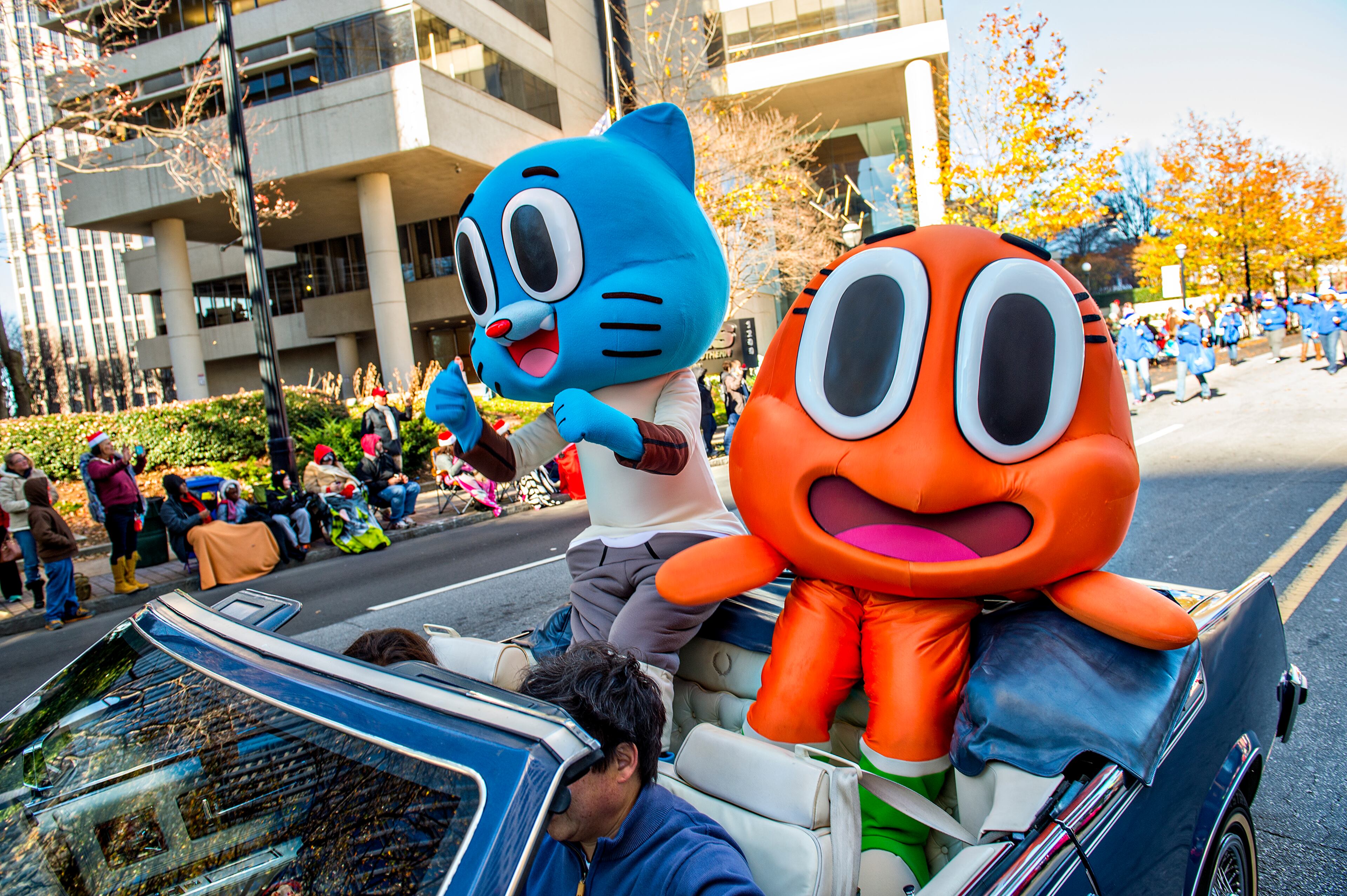 December 5, 2015 Atlanta - Cartoon Network characters Darwin and Gumball wave to the crowd during the 2015 Children's Christmas Parade in Atlanta on Saturday, December 5, 2015. Thousands gathered along Peachtree St. to watch the parade pass with marching bands, balloons, performances and more. JONATHAN PHILLIPS / SPECIAL