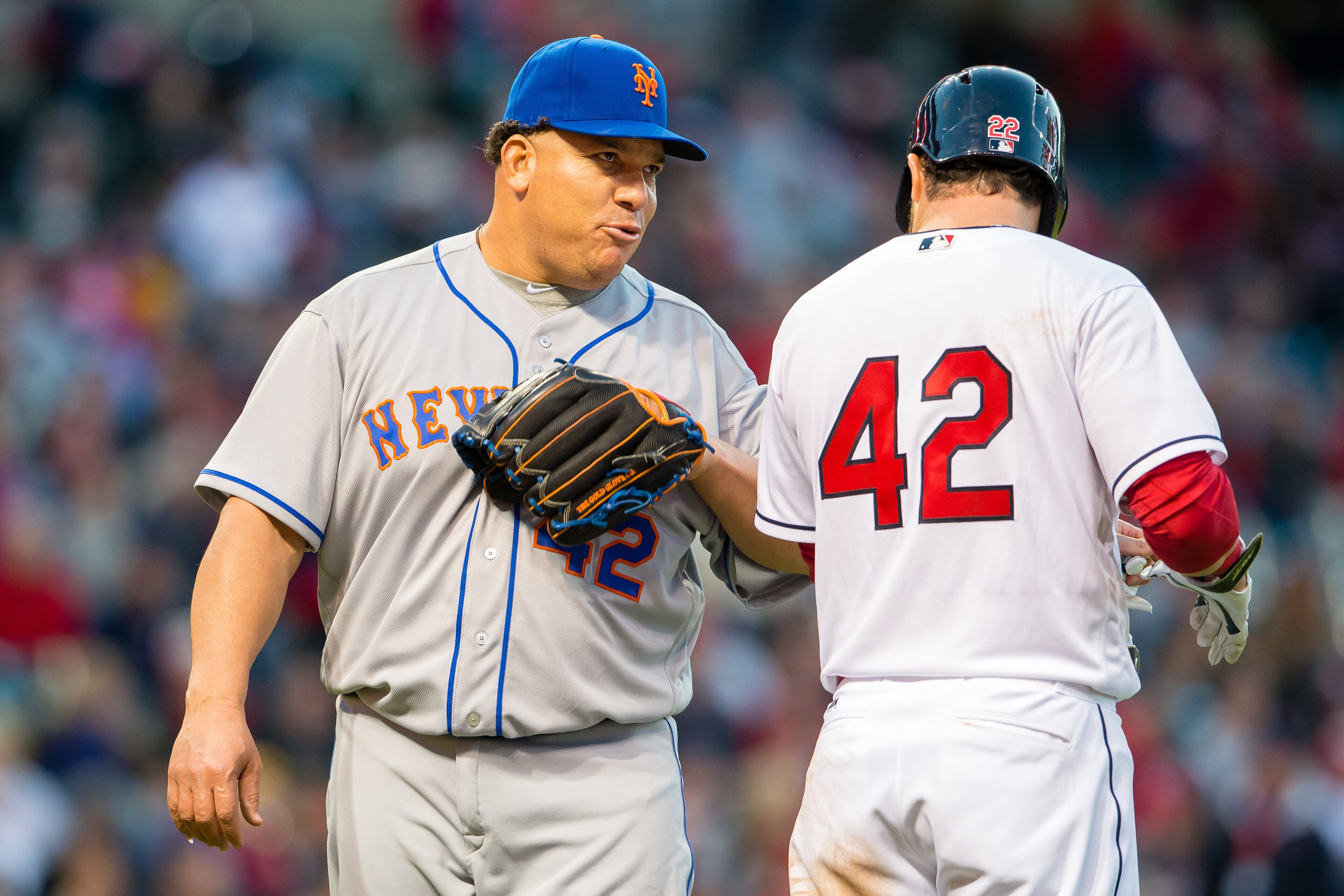 Starting pitcher Bartolo Colon #40 of the New York Mets talk with Jason Kipnis #22 of the Cleveland Indians after Kipnis flew out to third to end the second inning at Progressive Field on April 15, 2016 in Cleveland, Ohio. All players are wearing #42 in honor of Jackie Robinson Day. (Photo by Jason Miller/Getty Images)