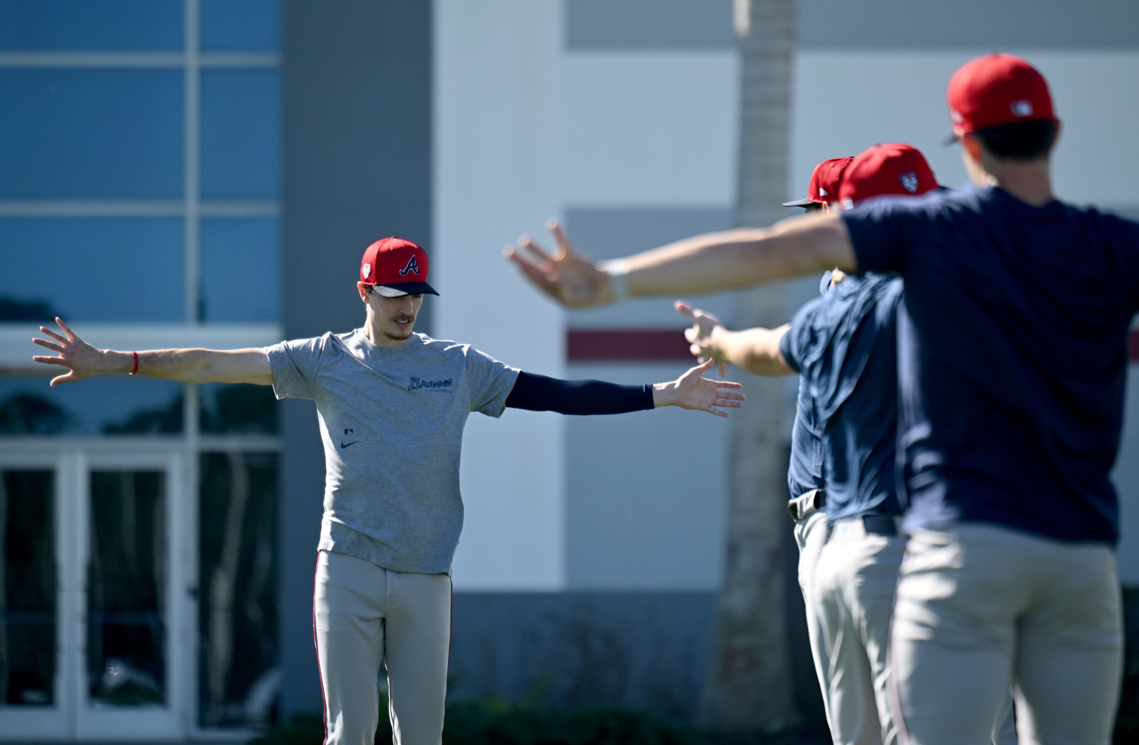 Braves starting pitcher Max Fried (left) warms up with other pitchers during spring training at CoolToday Park in North Port, Florida on Wednesday, Feb., 14, 2024. (Hyosub Shin / Hyosub.Shin@ajc.com)