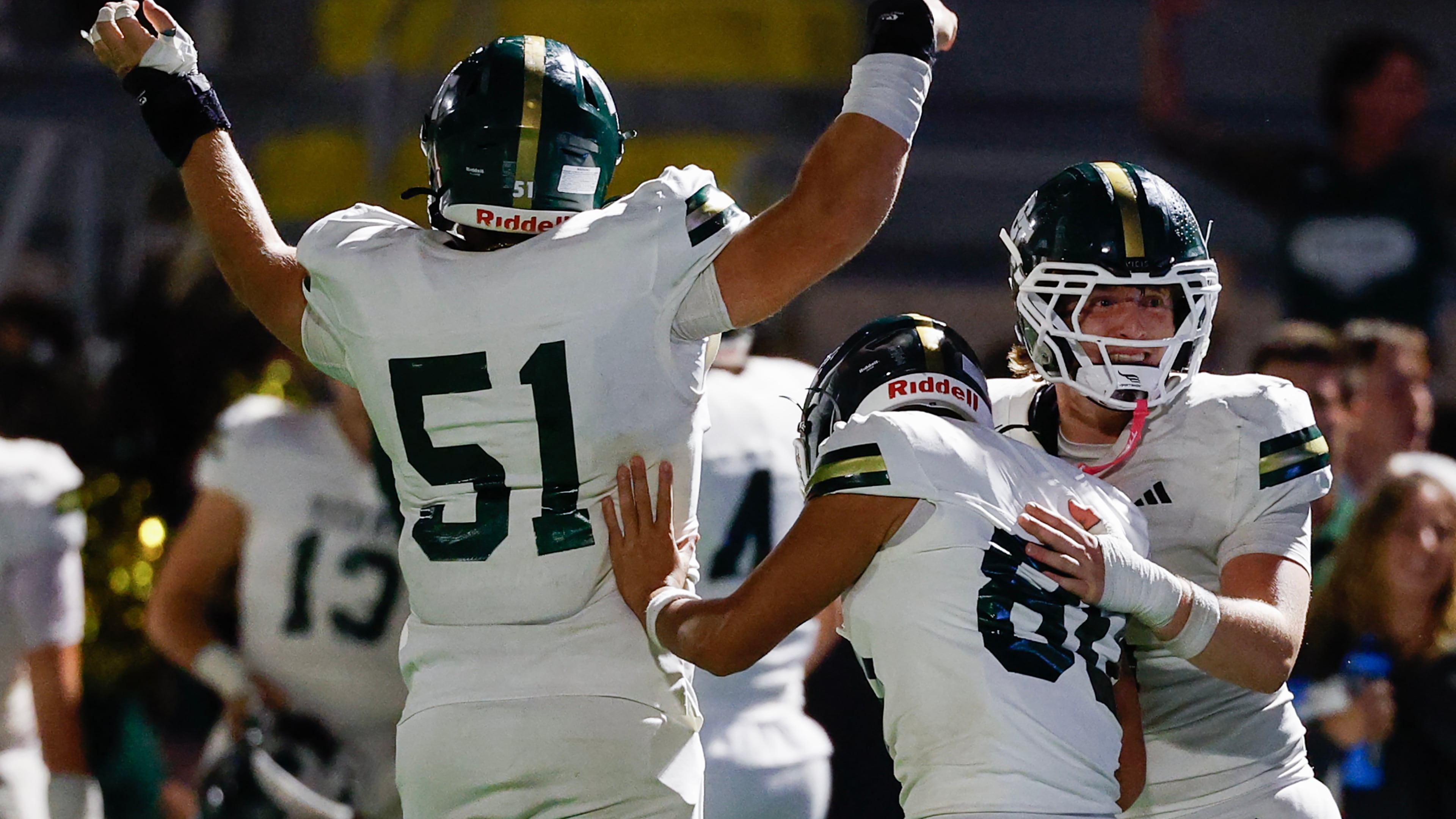 Blessed Trinity’s Bishop Dameron (right) and Caden Pyle (left) congratulate kicker Richard Morthland on his game-winning field goal against Marist on Friday, Sept. 25, 2026, in Atlanta. (Erik S. Lesser for the AJC)