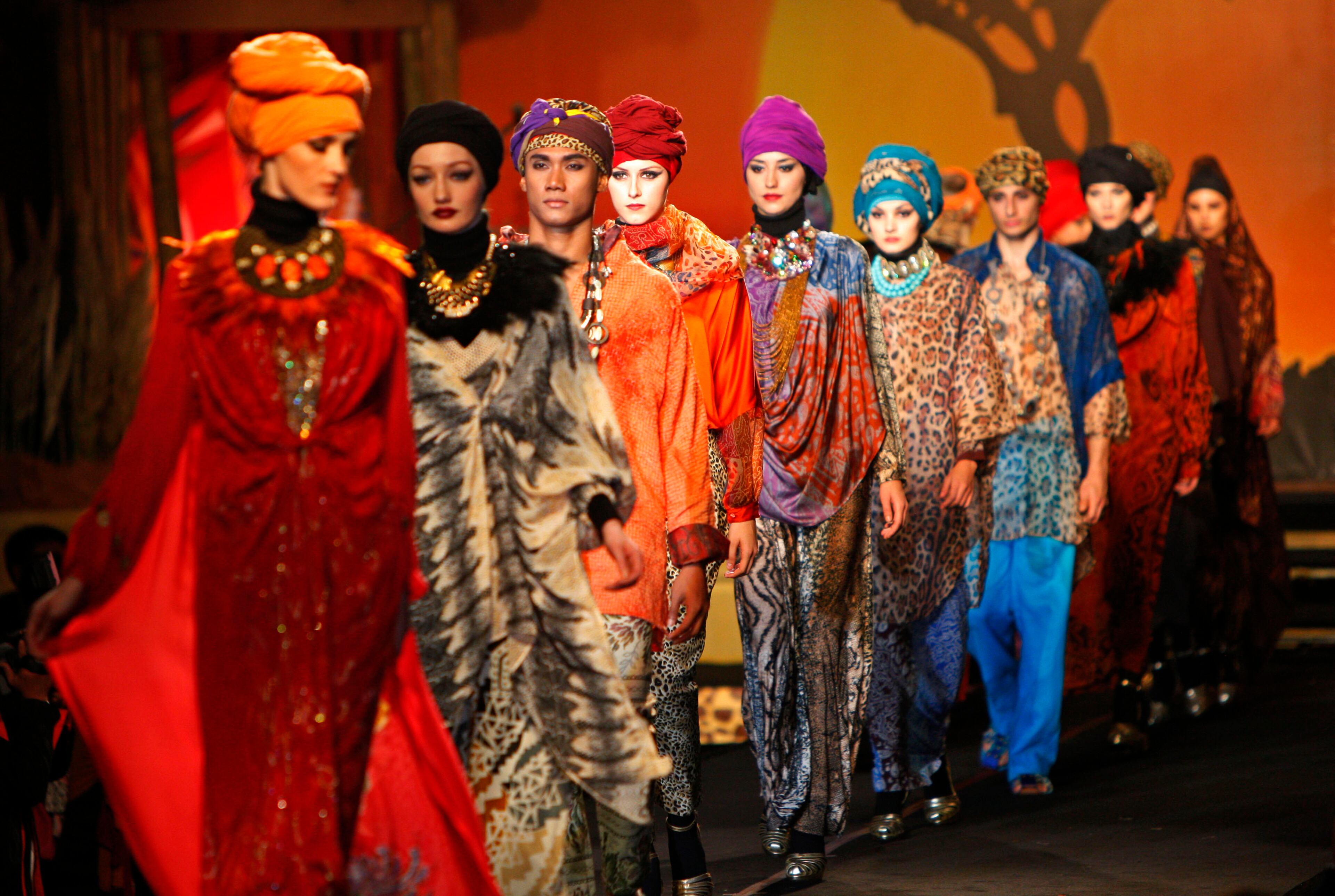 Models present creations by designer Tom Abang Saufi from Malaysia during the Islamic Fashion Festival in Kuala Lumpur, Malaysia, Monday, Nov. 5, 2012.