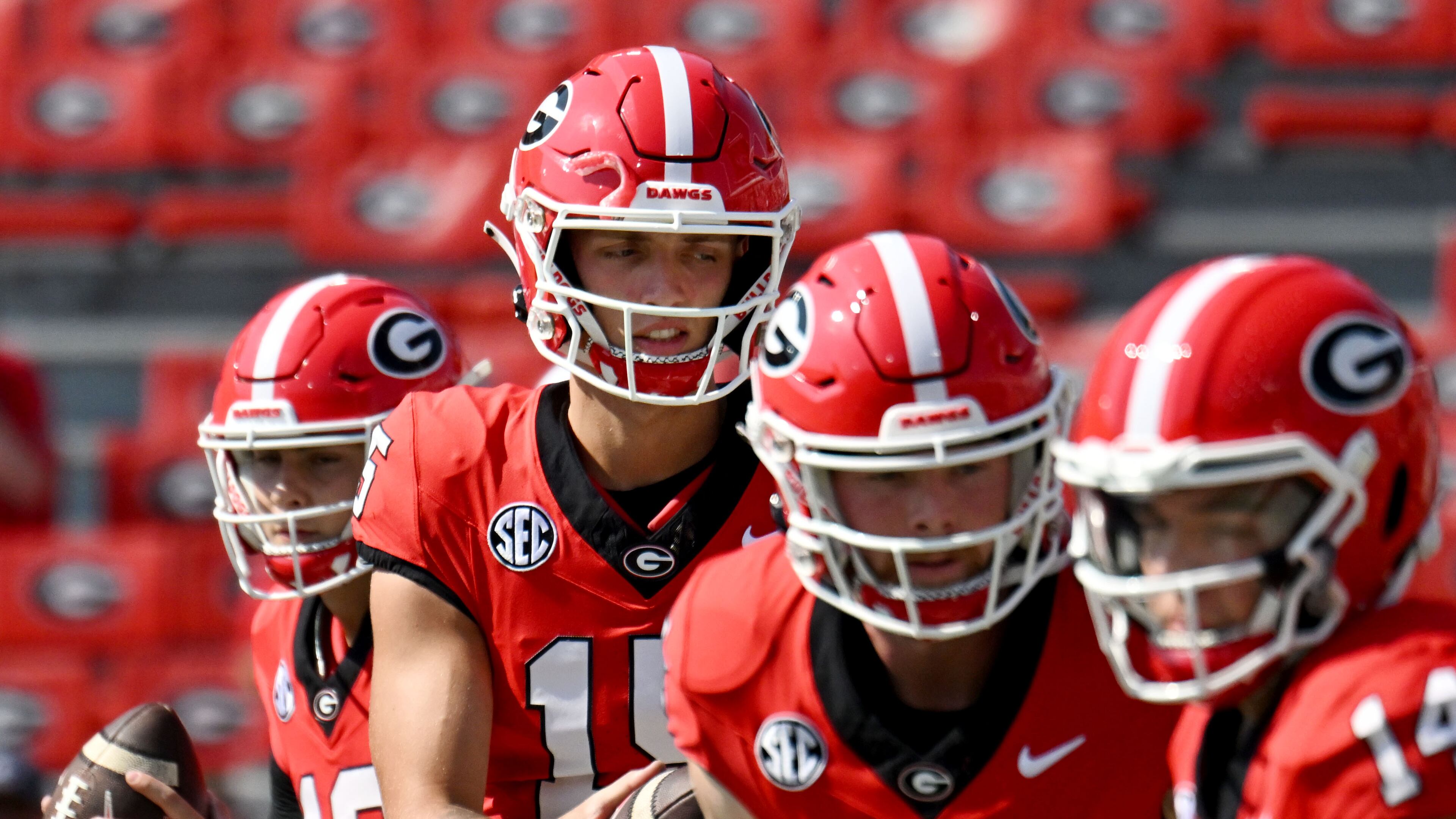 Georgia's quarterback Carson Beck (15) and other quarterbacks warm up during pregame workout before their game against Ball State in an NCAA football game at Sanford Stadium, Saturday, September 9, 2023, in Athens. (Hyosub Shin / Hyosub.Shin@ajc.com)
