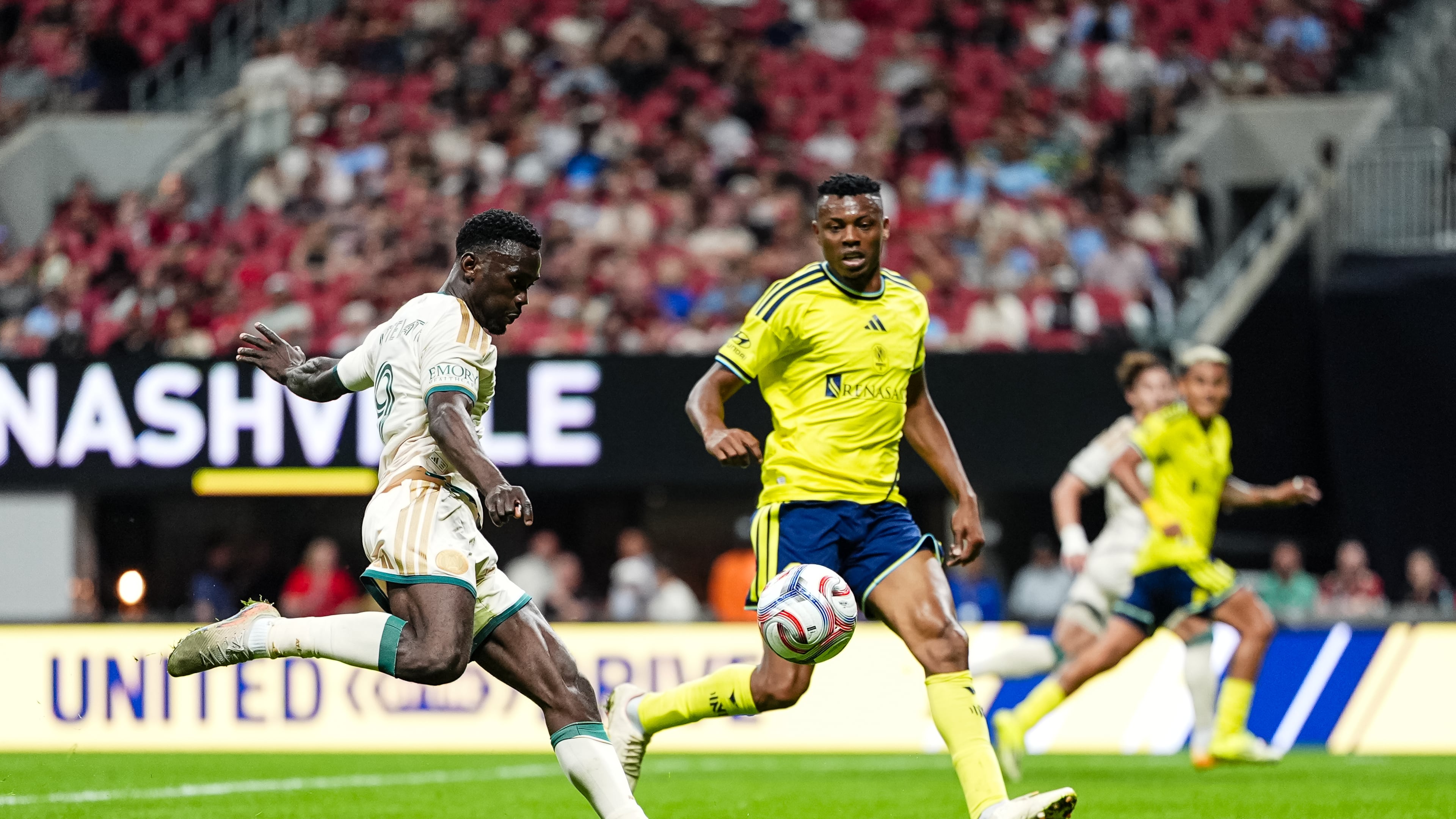 Atlanta United forward Emmanuel Latte Lath (left) kicks the ball Saturday, April 18, 2026, against Nashville SC at Mercedes-Benz Stadium in Atlanta. The Five Stripes lost 2-0. (Matthew Dingle/Atlanta United)