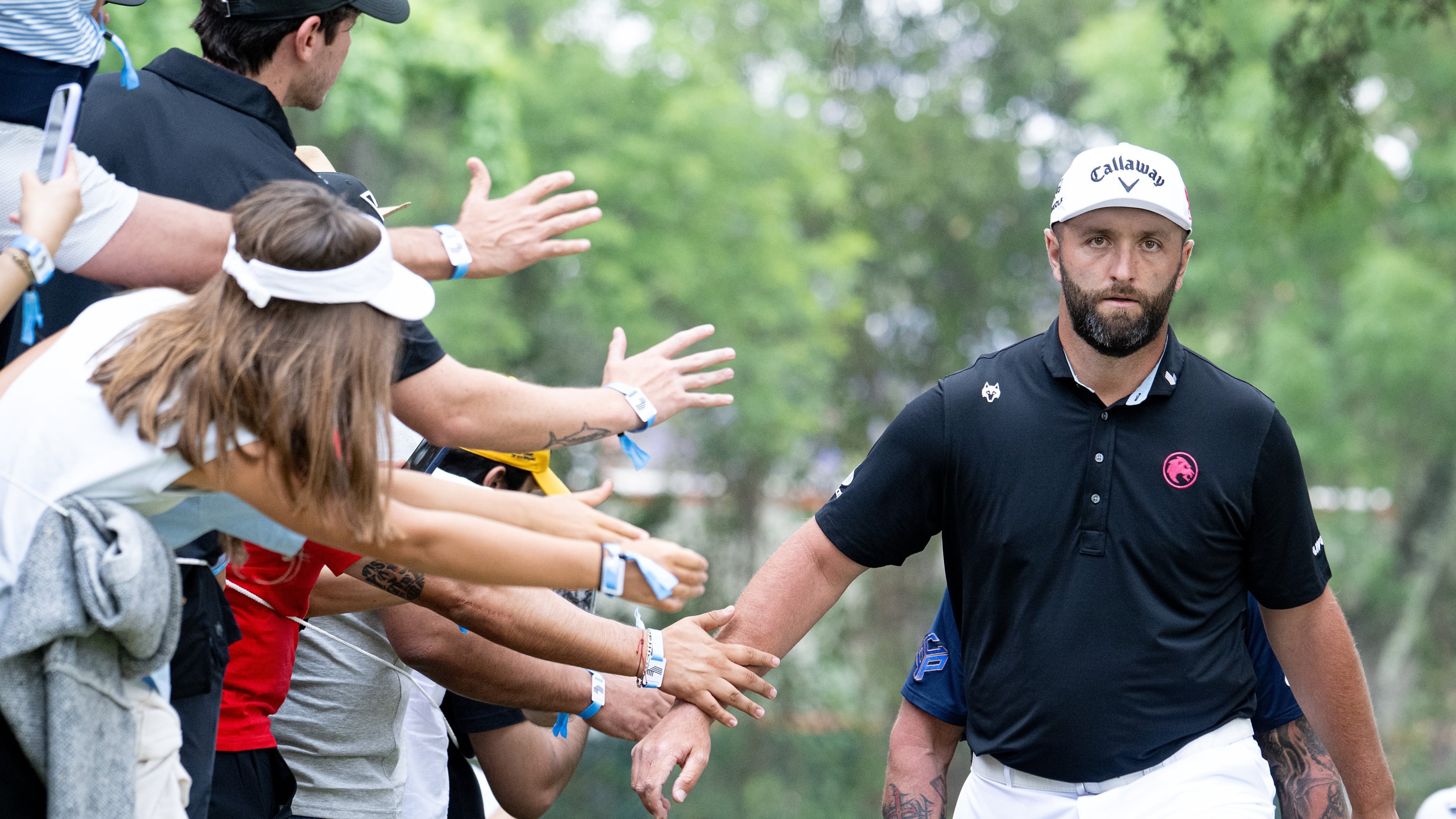 Captain Jon Rahm, right, of Legion XIII, greets fans as he walks to the sixth tee during the final round of LIV Golf Mexico City at Club de Golf Chapultepec on Sunday, April 19, 2026 in Naucalpan, Mexico. (Photo by Charles Laberge/LIV Golf via AP)