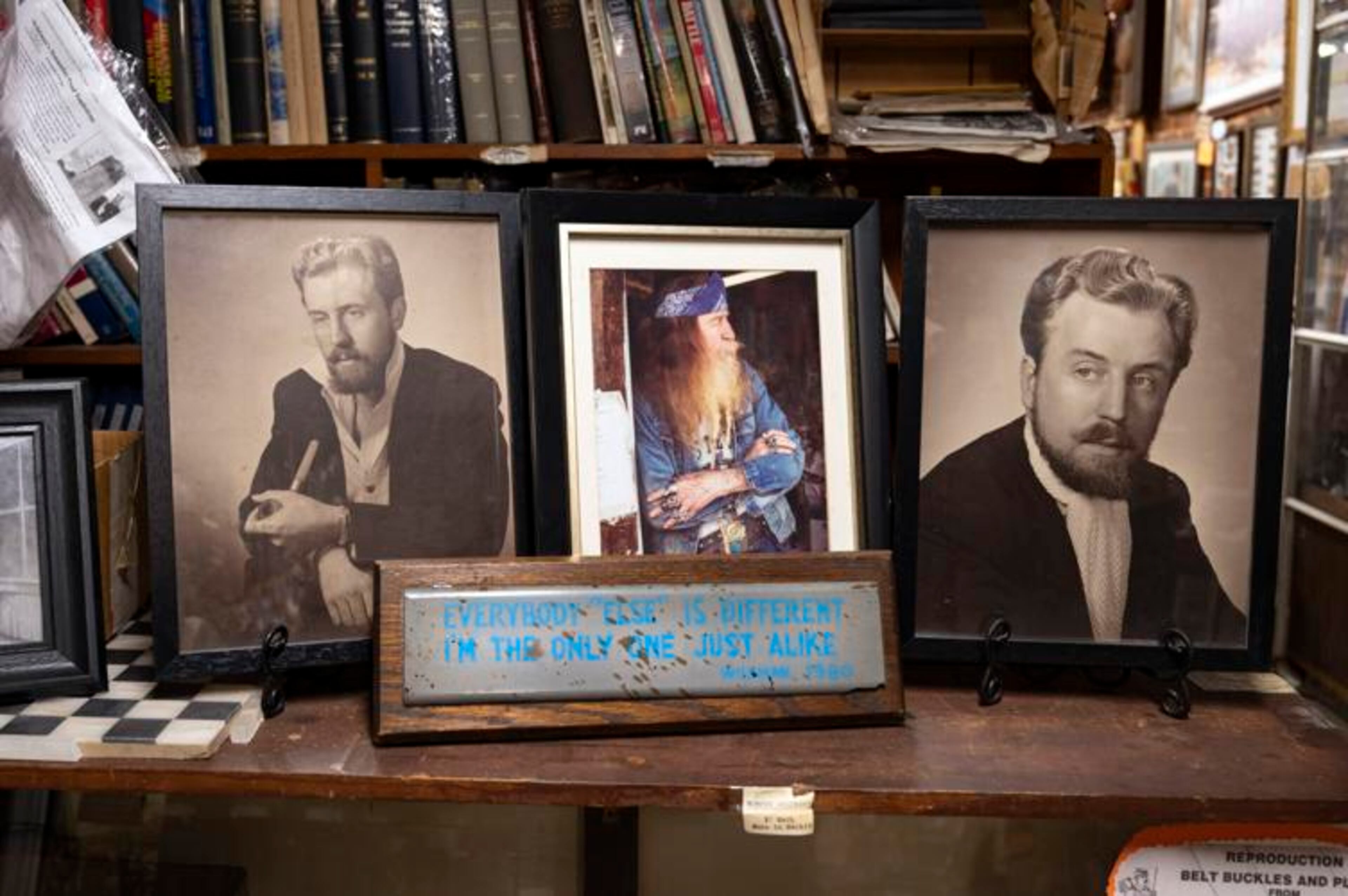 Friends of the late Dent Myers, known as the colorful, outspoken and politically-incorrect owner of downtown Kennesaw's Civil War Surplus shop, gathered in his memory. Pictured: Display of Myers' early publicity photos during his movie career. (Courtesy of Robin Rayne)