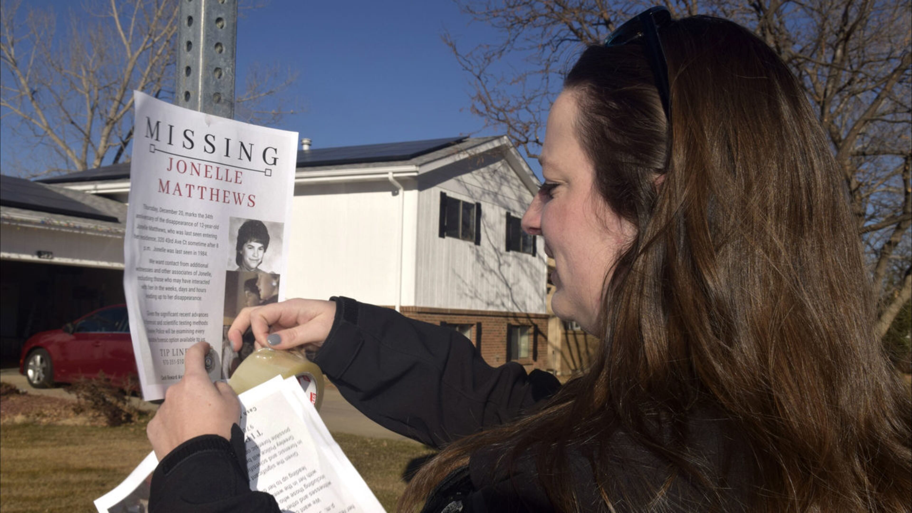 A Greeley, Colo., victim’s advocate posts a missing persons flier for Jonelle Matthews in December 2018, 34 years after the 12-year-old’s disappearance. The girl’s remains were discovered Tuesday, July 23, 2019, in rural Weld County. Joe Moylan/The Greeley Tribune via AP
