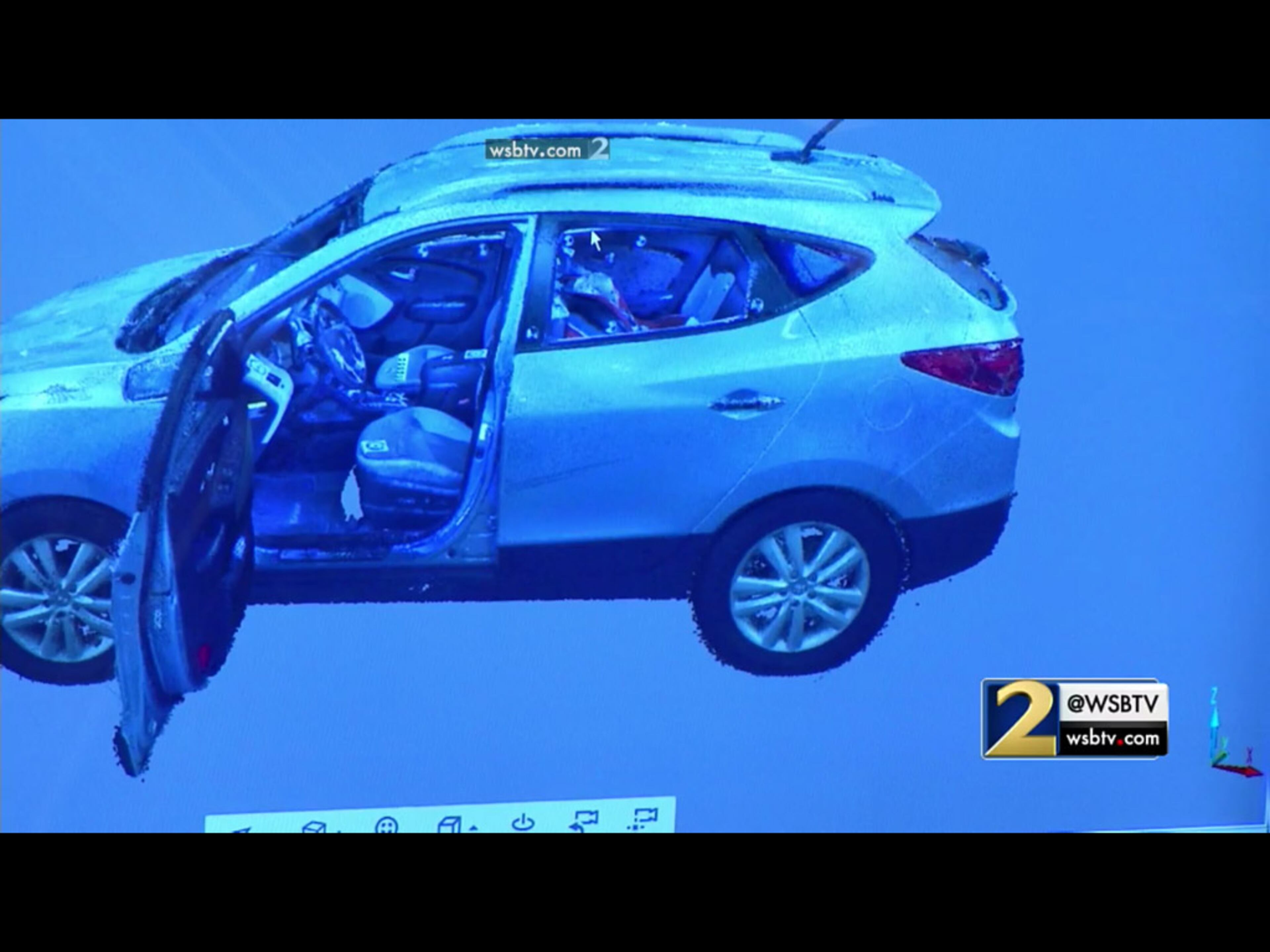 The prosecution shows cutaway details of a 3D laser scan of Justin Ross Harris' SUV, during Harris' murder trial at the Glynn County Courthouse in Brunswick, Ga., on Friday, Oct. 28, 2016. (screen capture via WSB-TV)