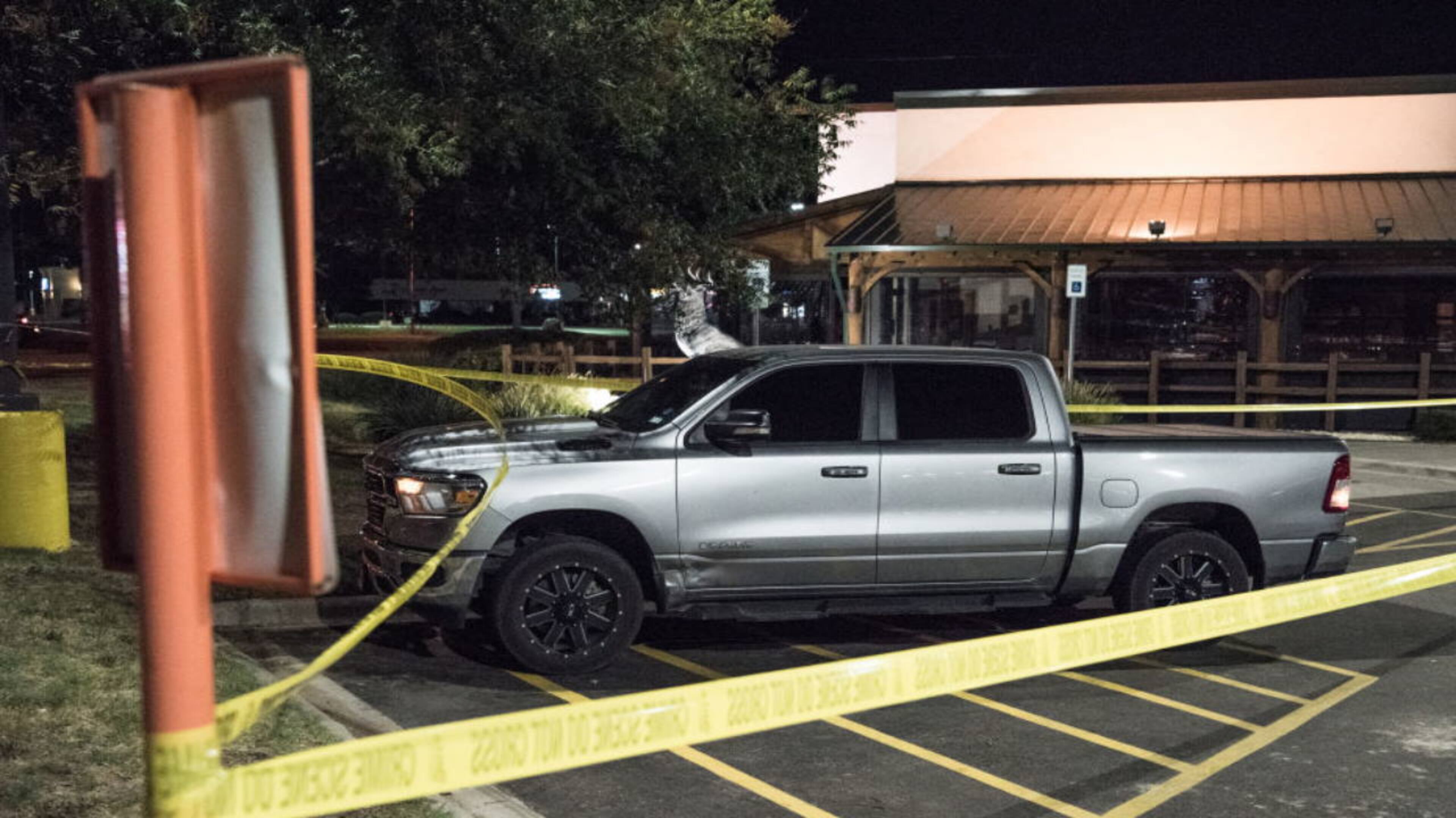 Odessa and Midland police and sheriff's deputies surround the area behind the Cinergy movie theater in Odessa, Texas, after shooting broke out Saturday.