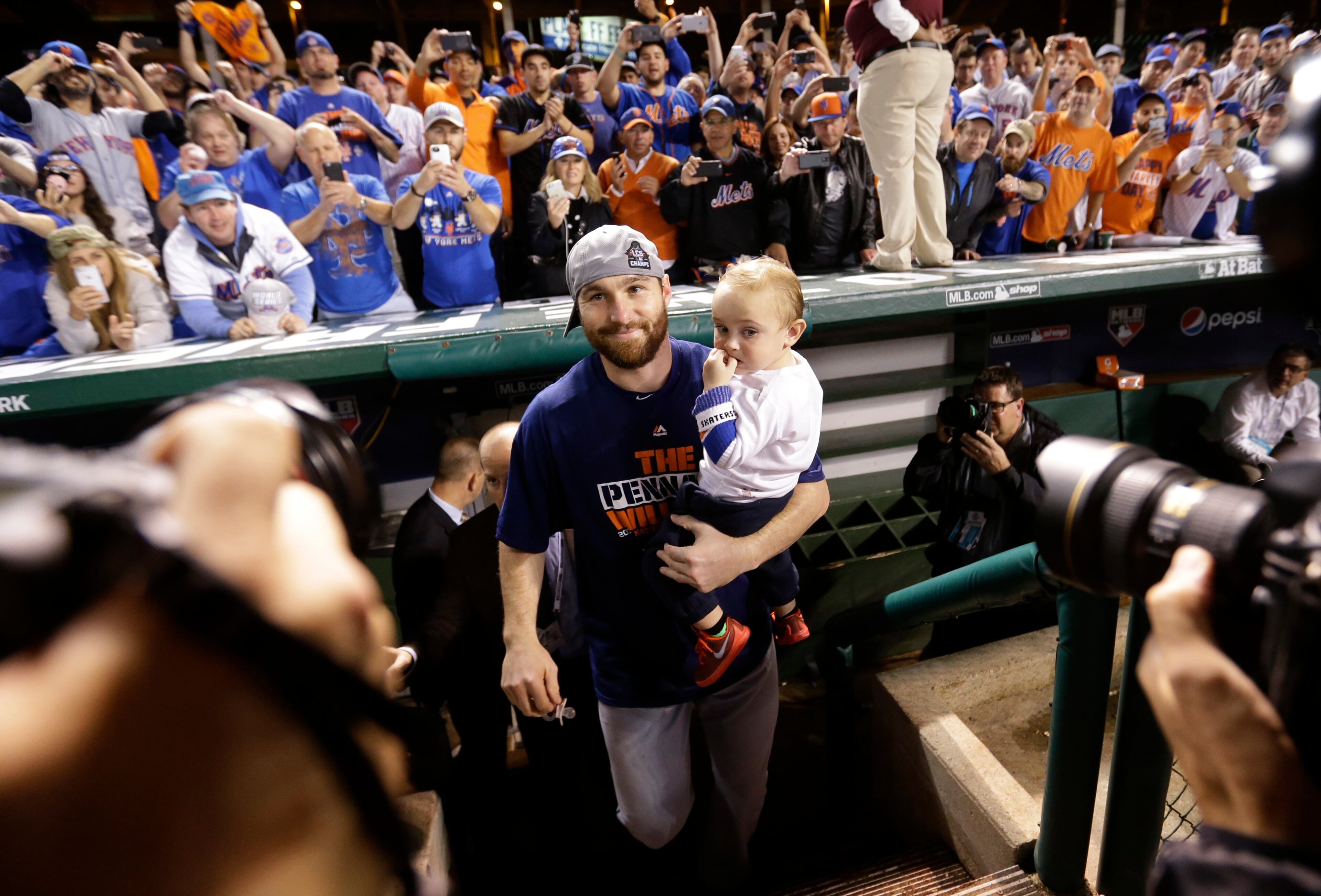 New York Mets' Daniel Murphy celebrates after Game 4 of the National League baseball championship series against the Chicago Cubs Wednesday, Oct. 21, 2015, in Chicago. The Mets won 8-3 to advance to the World Series. (AP Photo/David Goldman)