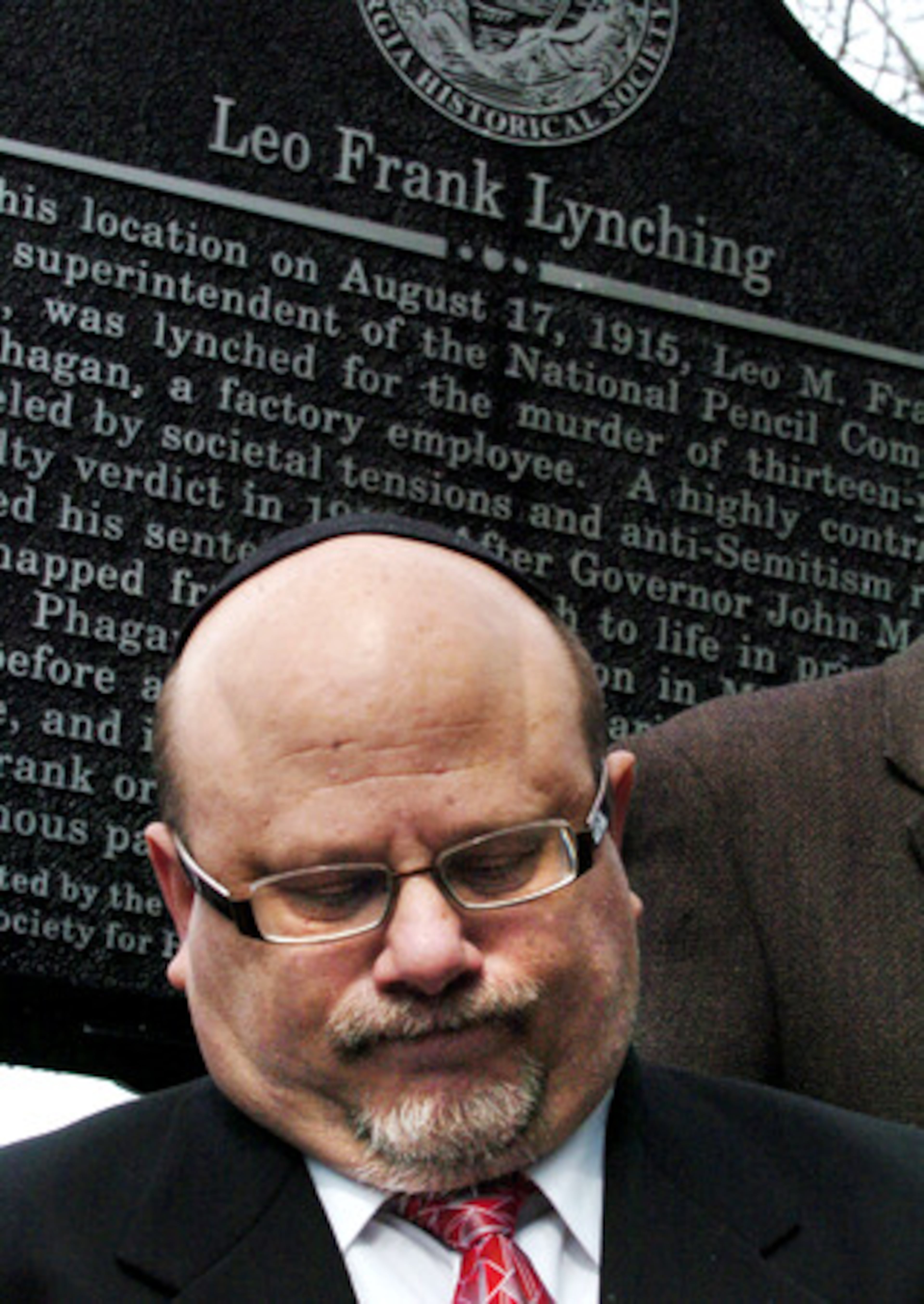 Rabbi Steven Lebow, of Temple Kol Emeth, stands in front of the newest marker remembering Leo Frank. "This is an unfortunate part of Marietta's history, but it needs to be remembered," Lebow said. "For Jews, memory is the beginning of redemption."