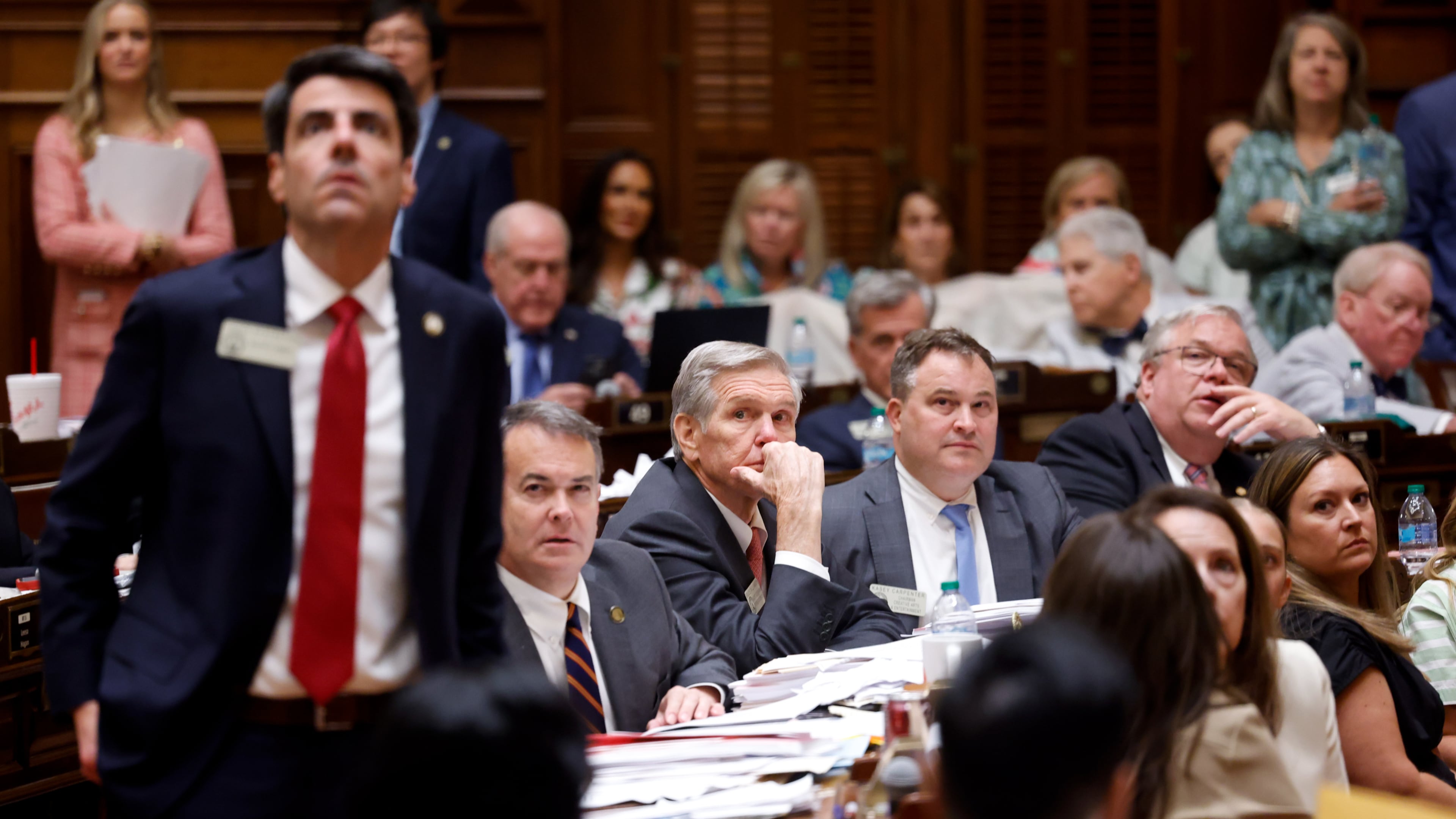 Representatives watch the voting board following a vote on a property tax bill at the House of Representatives on Sine Die, the last day of the legislature, at the Capitol in Atlanta on April 2, 2026. (Arvin Temkar/AJC)