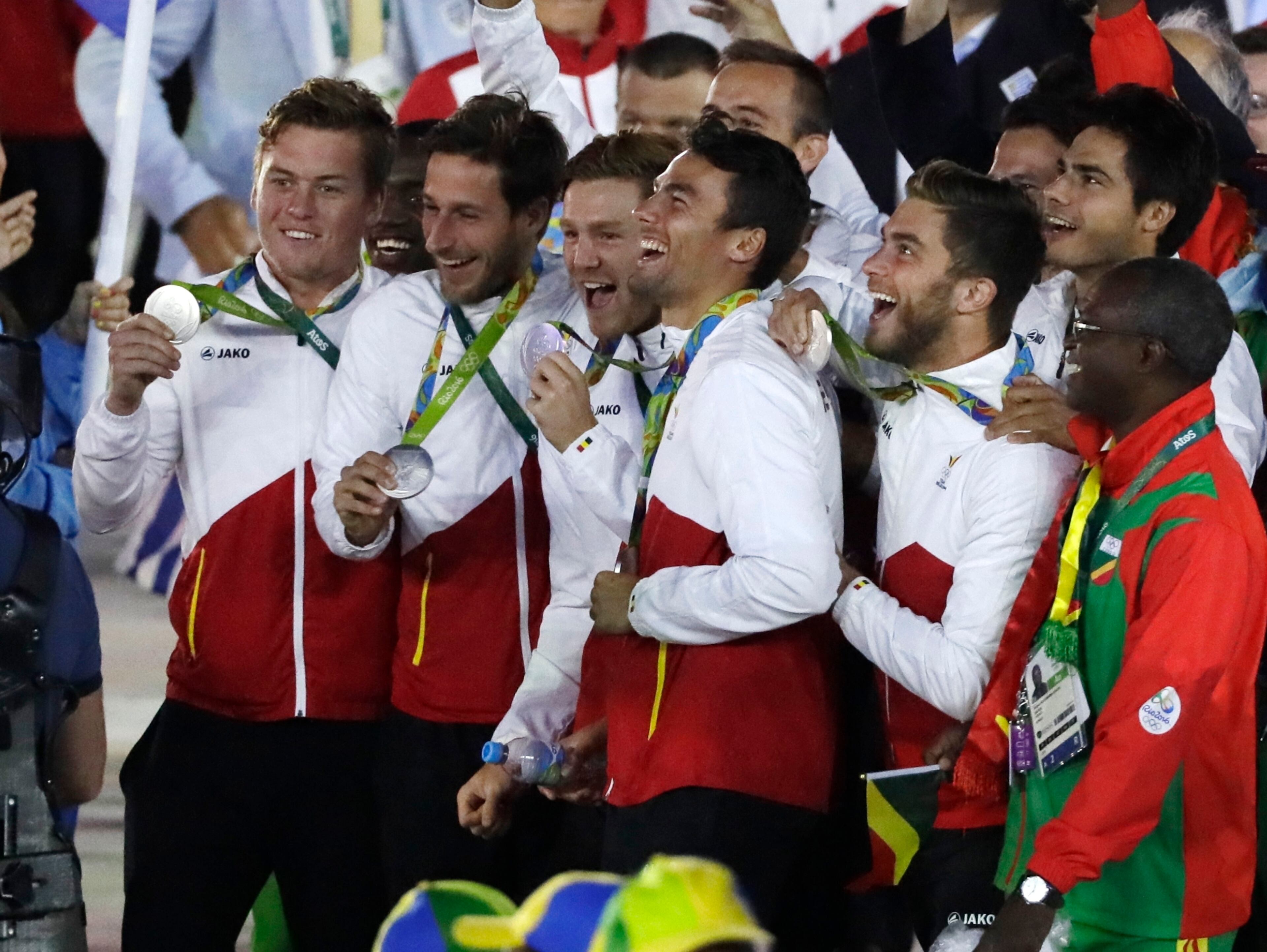 Belgium athletes show their silver medals during the closing ceremony in the Maracana stadium at the 2016 Summer Olympics in Rio de Janeiro, Brazil, Sunday, Aug. 21, 2016. (AP Photo/Mark Humphrey)