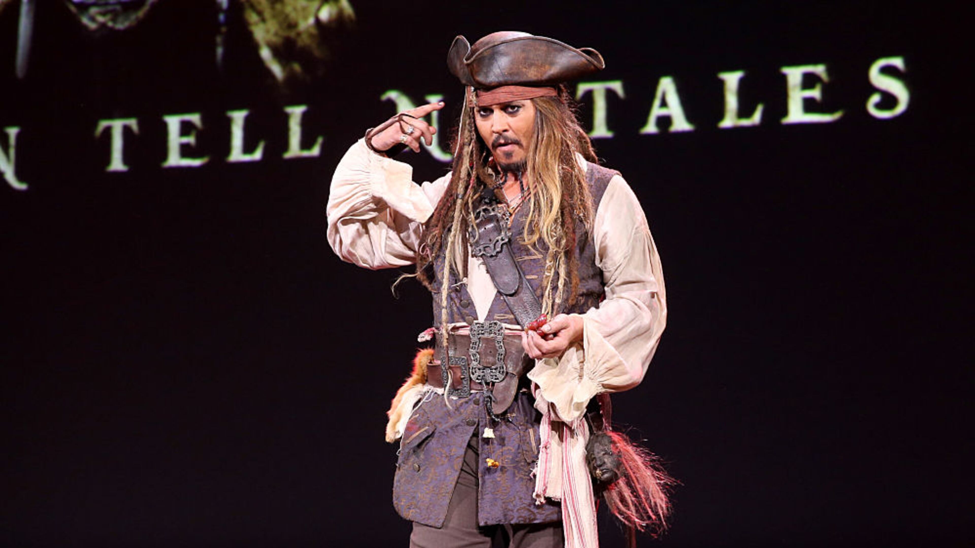 ANAHEIM, CA - AUGUST 15: Actor Johnny Depp, dressed as Captain Jack Sparrow, of PIRATES OF THE CARIBBEAN: DEAD MEN TELL NO TALES took part today in "Worlds, Galaxies, and Universes: Live Action at The Walt Disney Studios" presentation at Disney's D23 EXPO 2015 in Anaheim, Calif. (Photo by Jesse Grant/Getty Images for Disney)