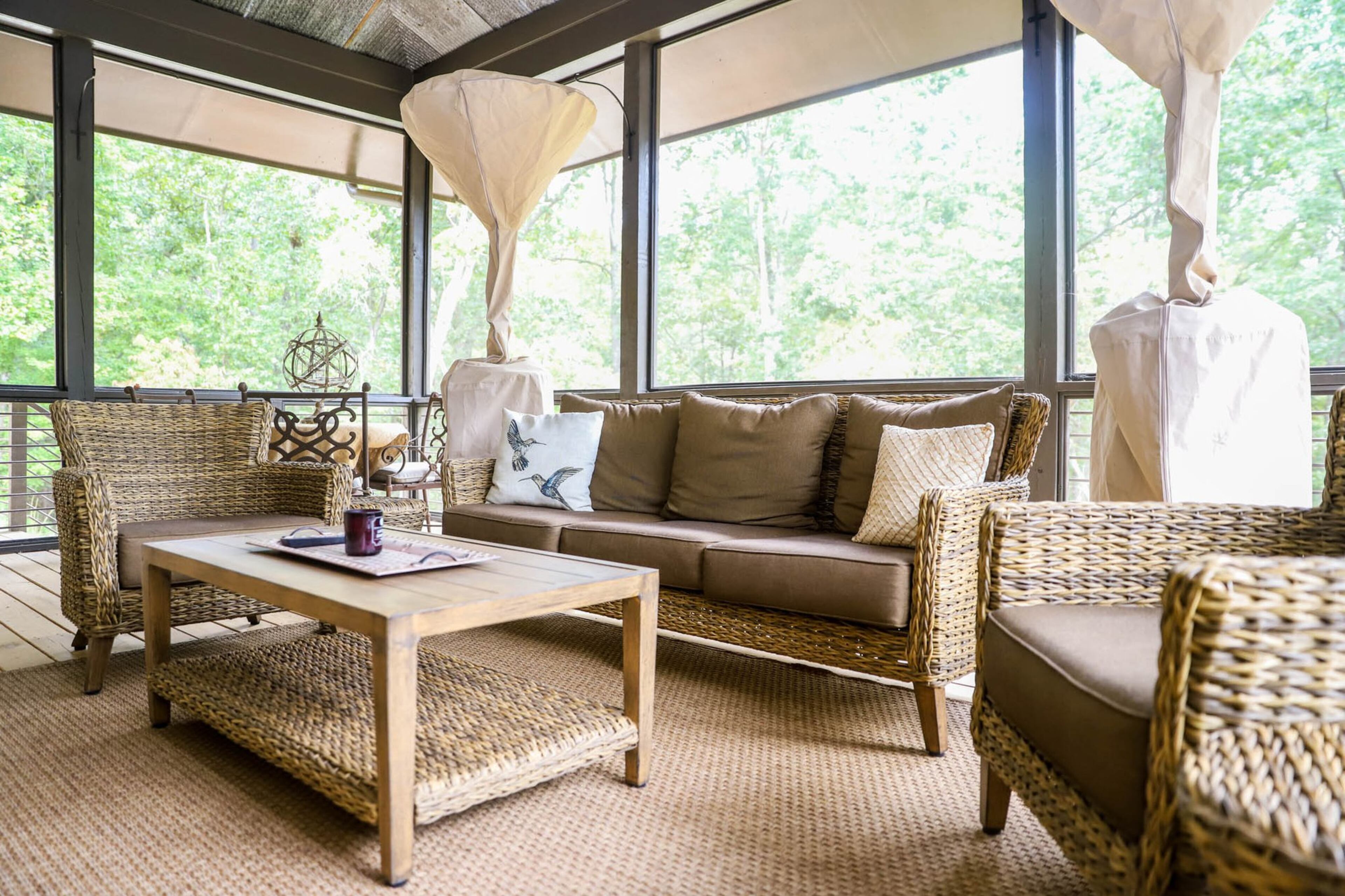 Jennifer and Michael Marblestone entertain often, hosting parties and church events, and having outdoor spaces for those gatherings is incredibly helpful. The screened-in porch is great for relaxing in cooler weather, and they have heaters out there if it gets too cold. Furniture from Costco and Target provides ample seating. Text by Shannon Dominy. Photo by Reynolds Rogers.