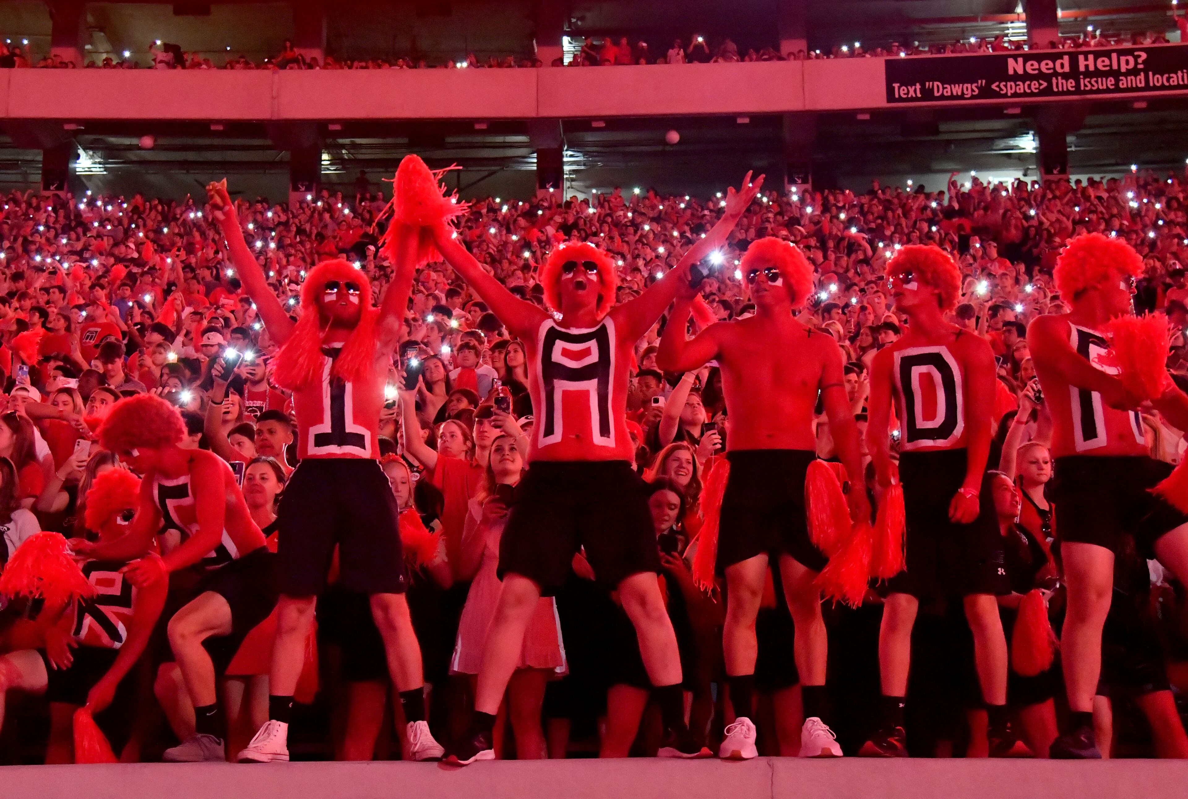 Georgia fans celebrate at the start of the fourth quarter as Sanford Stadium goes red in an NCAA football game against the UAB at Sanford Stadium, Saturday, September 23, 2023, in Athens. Georgia won 42-21 over UAB. (Hyosub Shin / Hyosub.Shin@ajc.com)