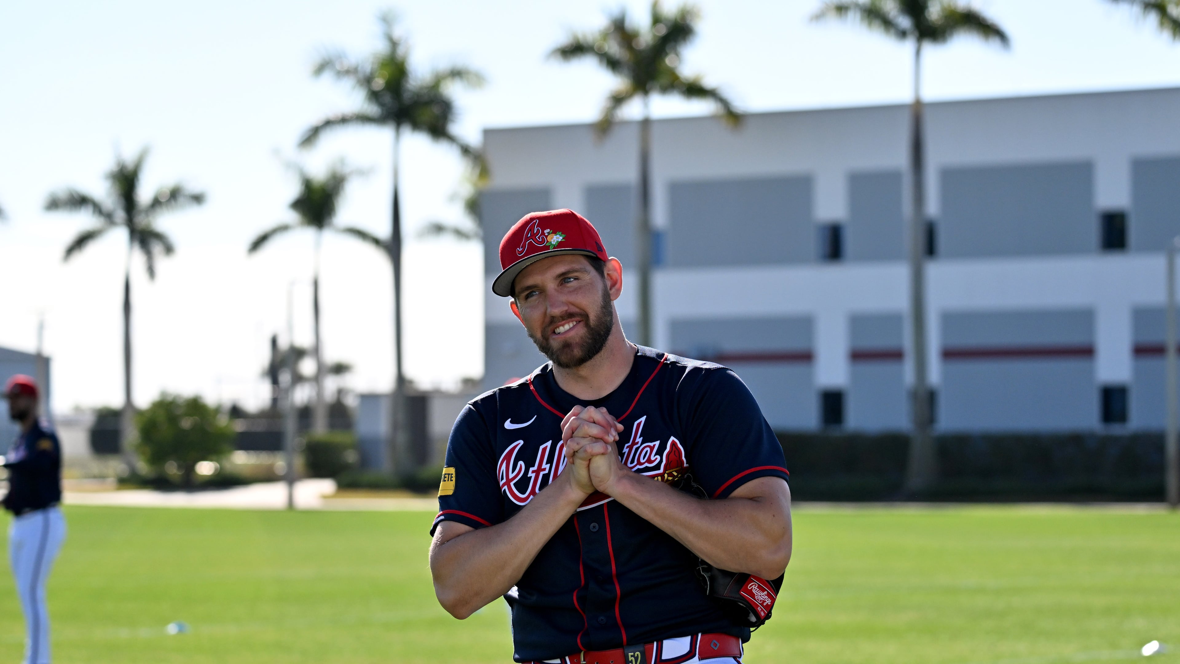 Braves pitcher Dylan Lee reacts — pictured during spring training workouts in February — made his MLB debut in 2021 a month before Atlanta won the World Series. (Hyosub Shin/AJC)