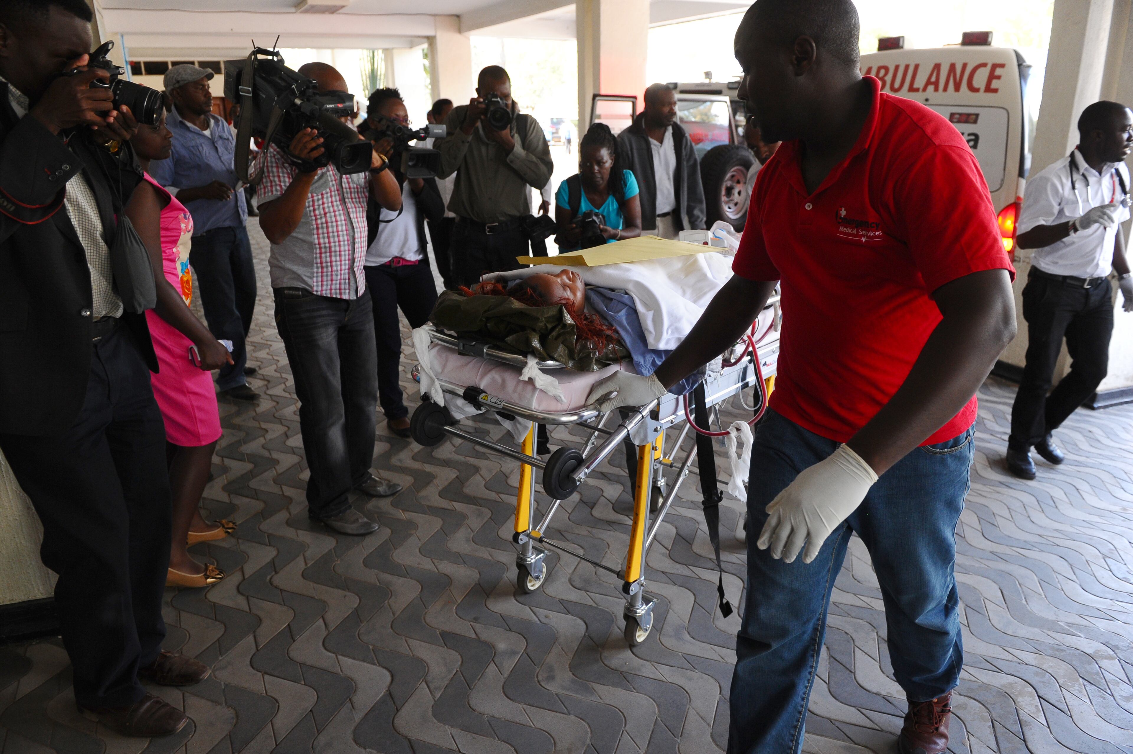 Medics help an injured person at Kenyatta National Hospital in Nairobi, Kenya, Thursday, April 2, 2015, after being airlifted from Garissa after an attack by gunmen at Garissa University College in northeastern Kenya on Thursday morning. Witnesses say the gunmen who stormed a college in Kenya Thursday morning identified themselves as members of al-Shabab, the Islamic extremist group from neighboring Somalia. (AP Photo)