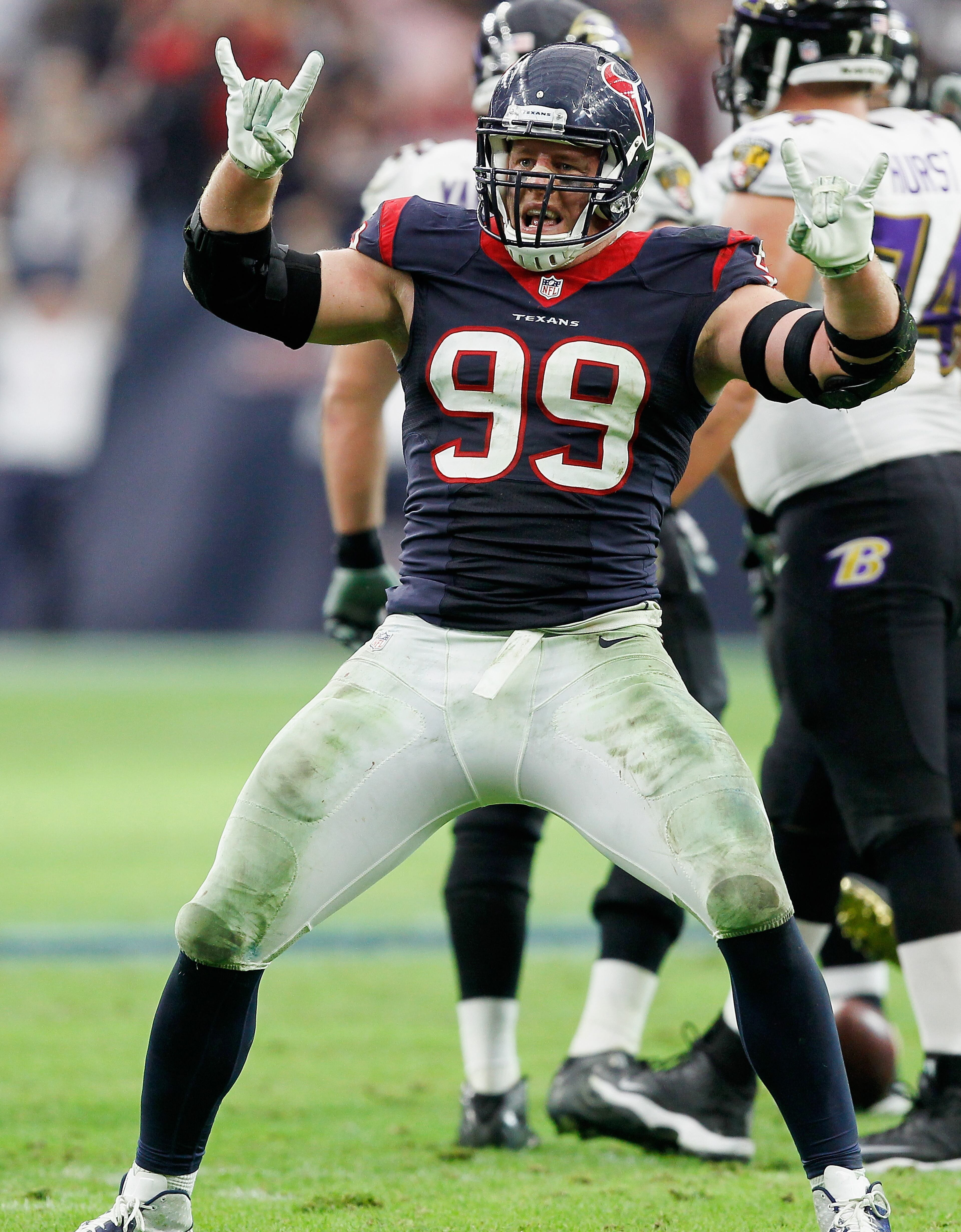 J.J. Watt of the Houston Texans celebrates after sacking Joe Flacco of the Baltimore Ravens. (Photo by Bob Levey/Getty Images)