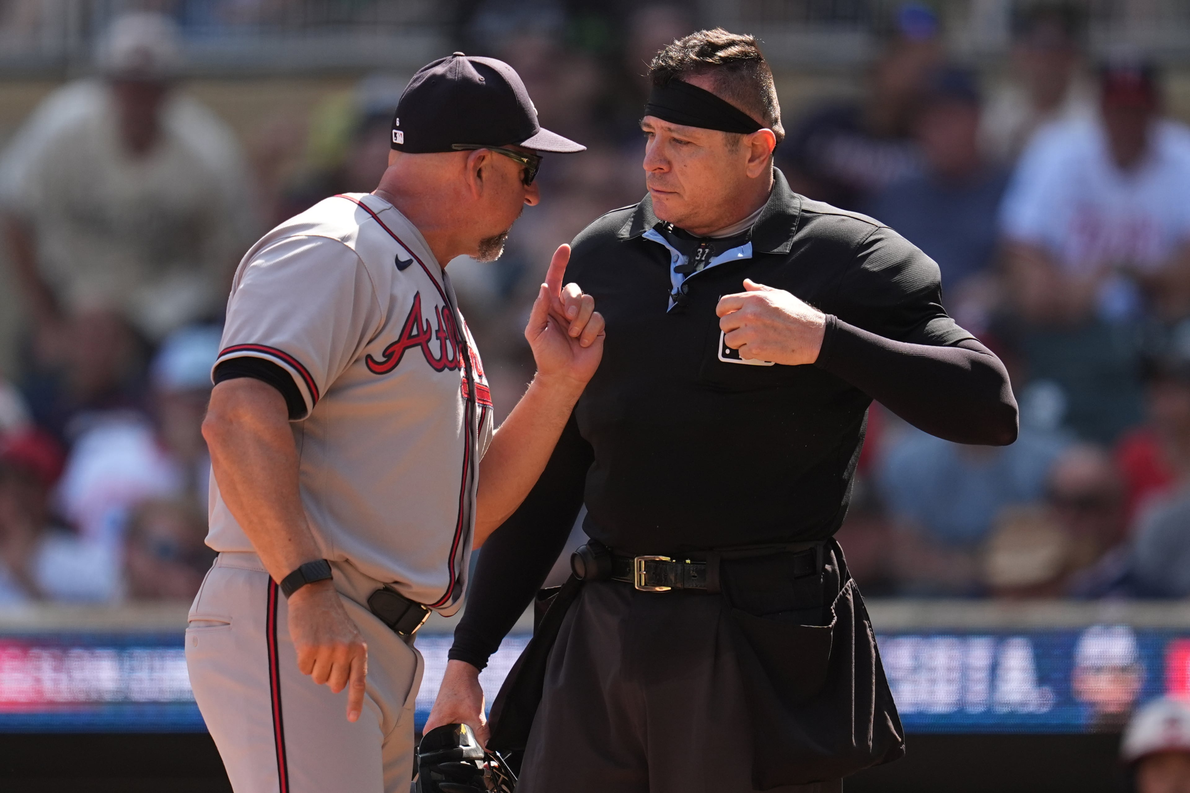 Braves manager Walt Weiss argues with home plate umpire Carlos Torres after being ejected in the eighth inning of Wednesday's game in Minneapolis. (Abbie Parr/AP)