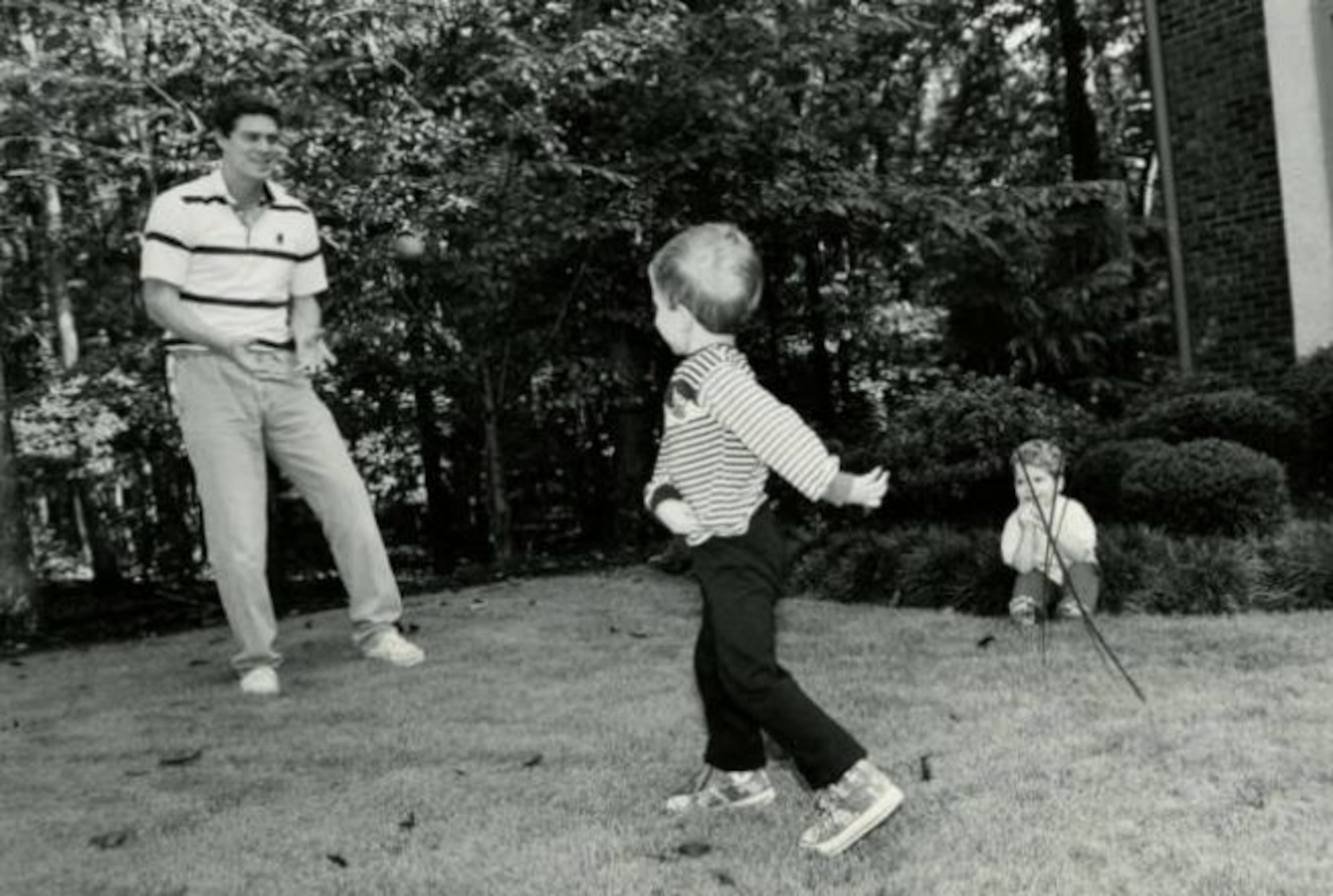 Oct. 10, 1989 -- Braves outfielder Dale Murphy plays catch with his 4-year old son, Tyson, at their home in Atlanta. AJC PHOTO ARCHIVES