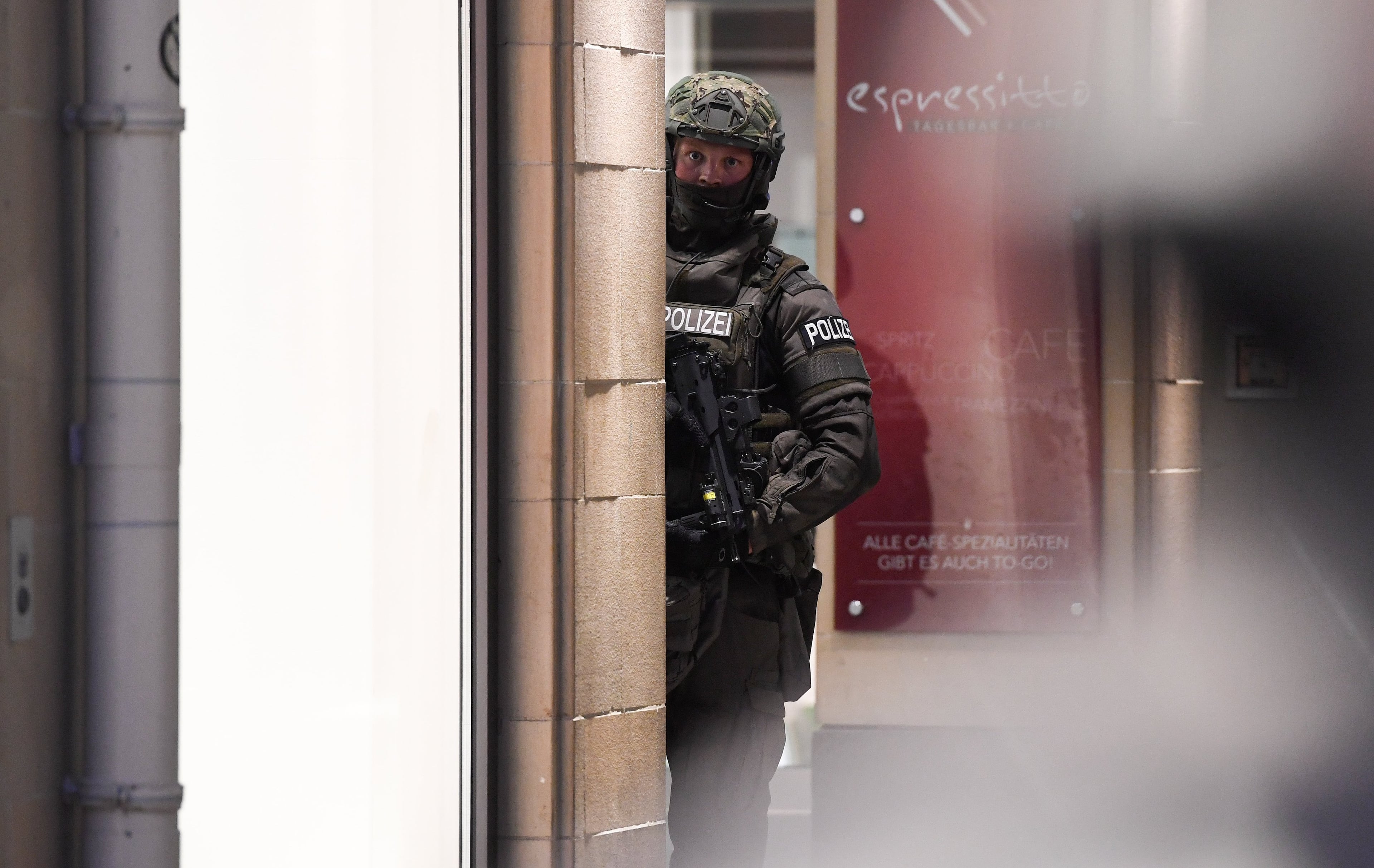 Police officer stands in downtown Munich after a shooting was reported there in Munich, southern Germany, Friday, July 22, 2016. Several people have been reported to be killed. (Sven Hoppe/dpa via AP)