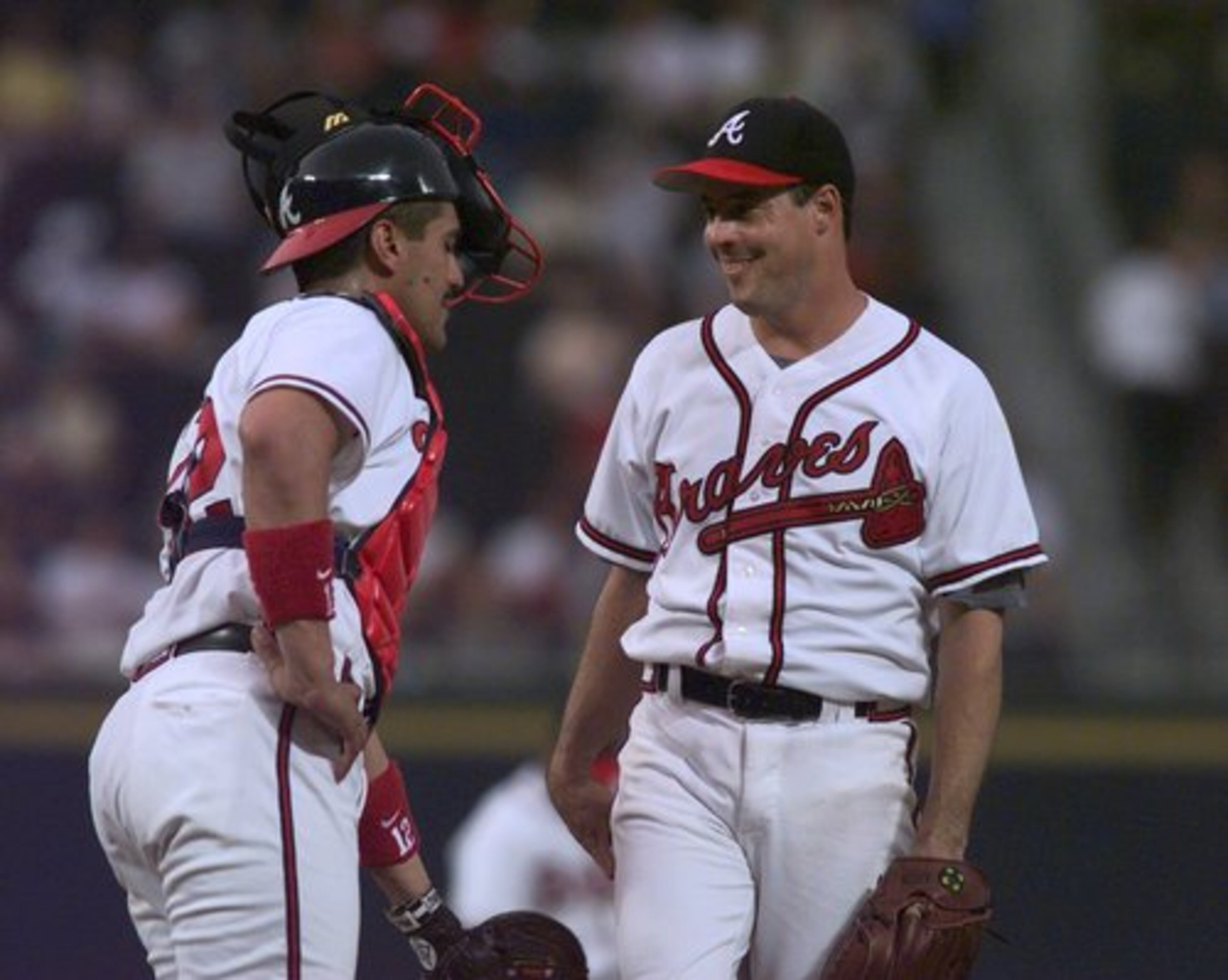 Greg Maddux (right) has 352 career victories.