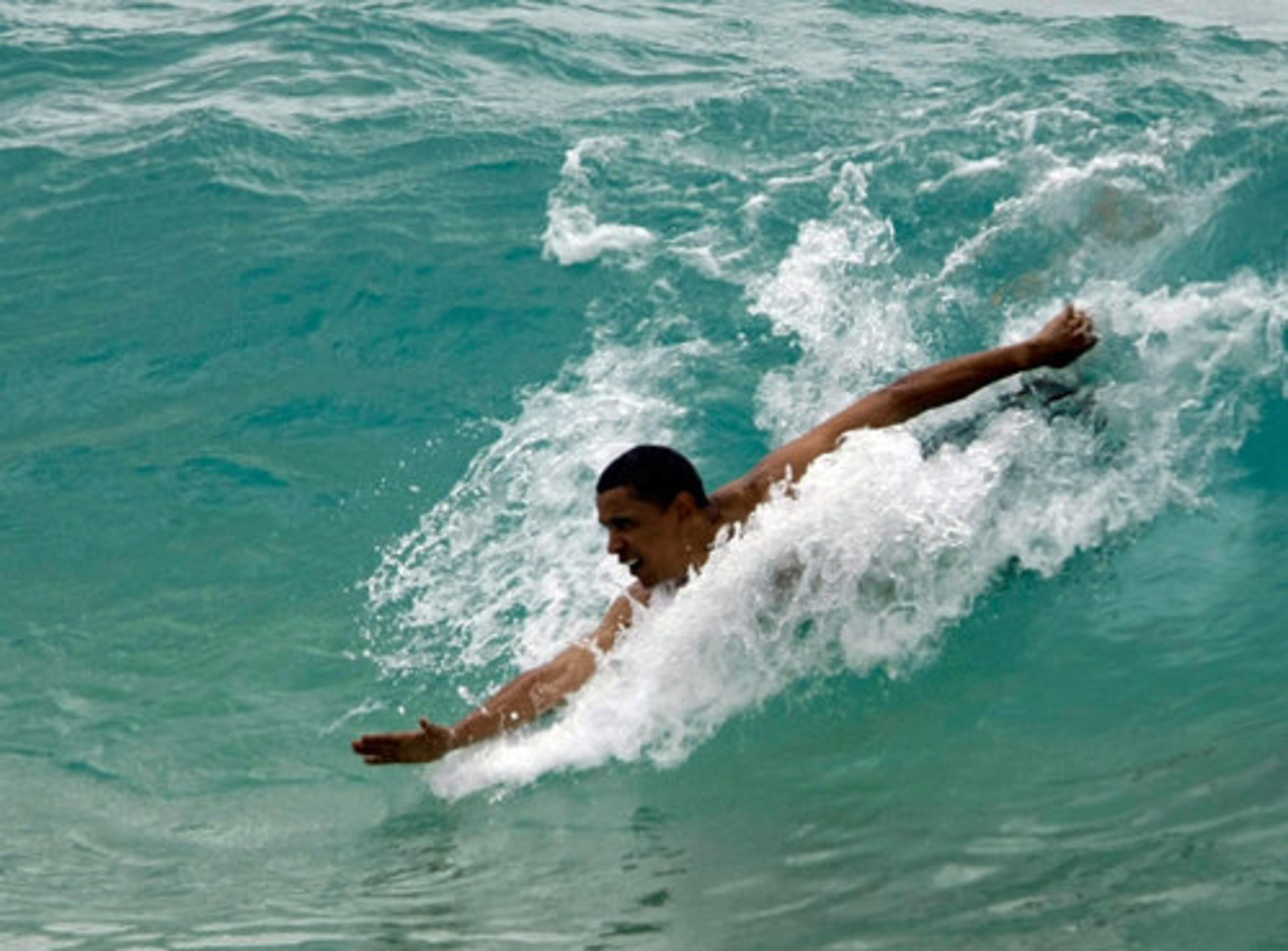 Vacationing Democratic presidential candidate Sen. Barack Obama, D-Ill., body surfs at Sandy Beach in Honolulu, Hawaii, on Thursday.