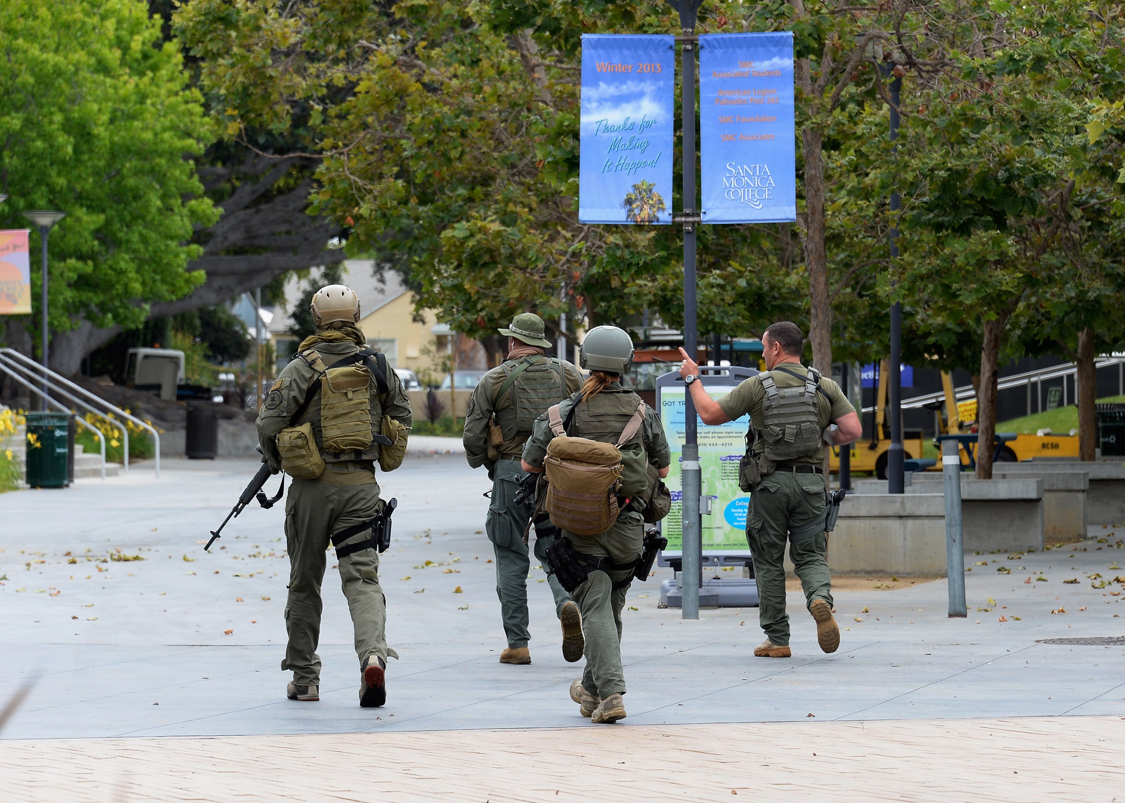 SANTA MONICA, CA - JUNE 07: Los Angeles County SWAT team members search the grounds of Santa Monica College near the library after multiple shootings were reported on the campus June 7, 2013 in Santa Monica, California. According to reports, at least three people have been injured, and a suspect was taken into custody. (Photo by Kevork Djansezian/Getty Images)