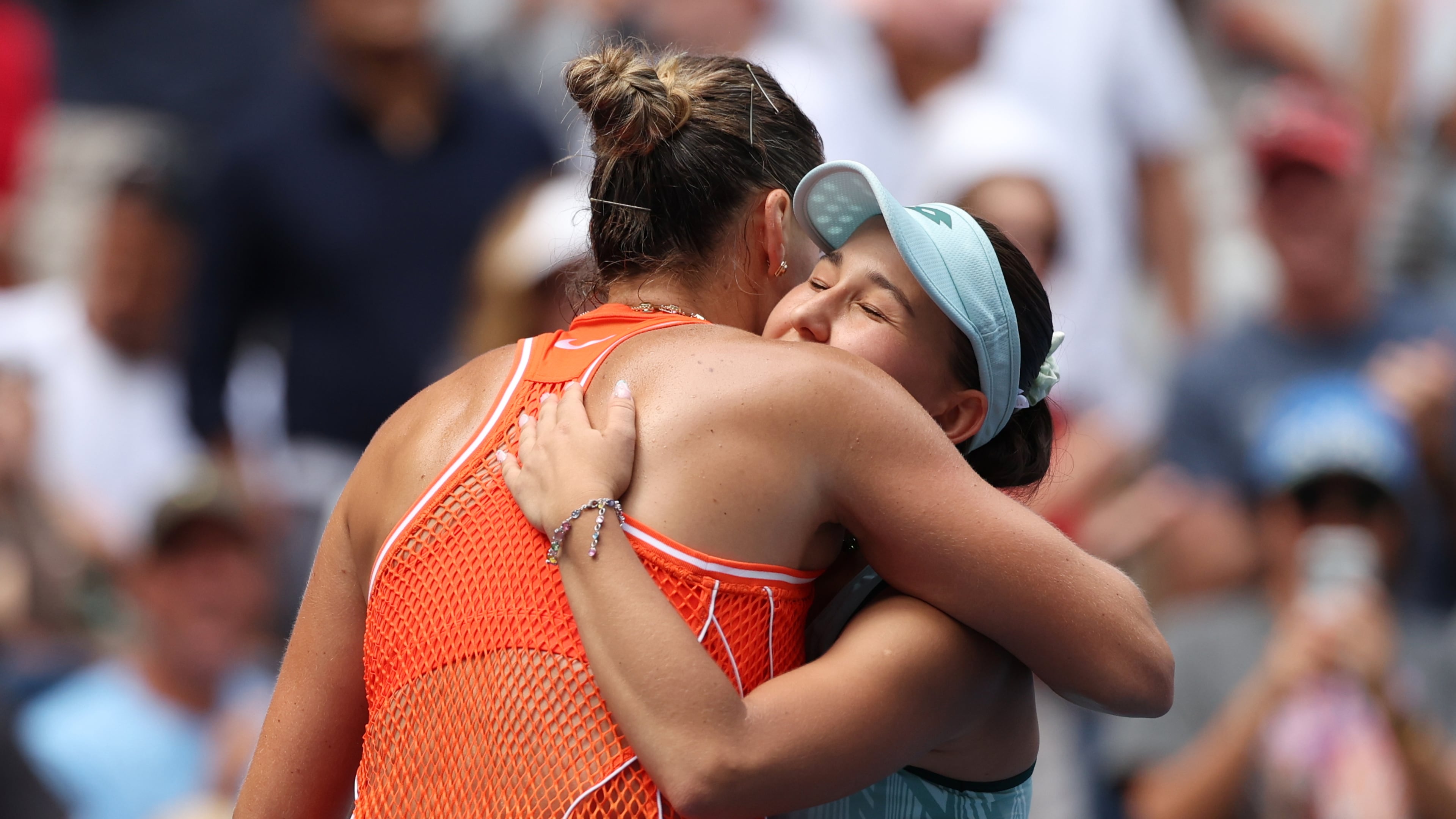 Aryna Sabalenka, of Belarus, left, embraces Kamilla Rakhimova, of Uzbekistan, after Sabalenka won their match during the third round of the U.S. Open tennis championships Friday, Sept. 4, 2026, in New York. (AP Photo/Heather Khalifa)