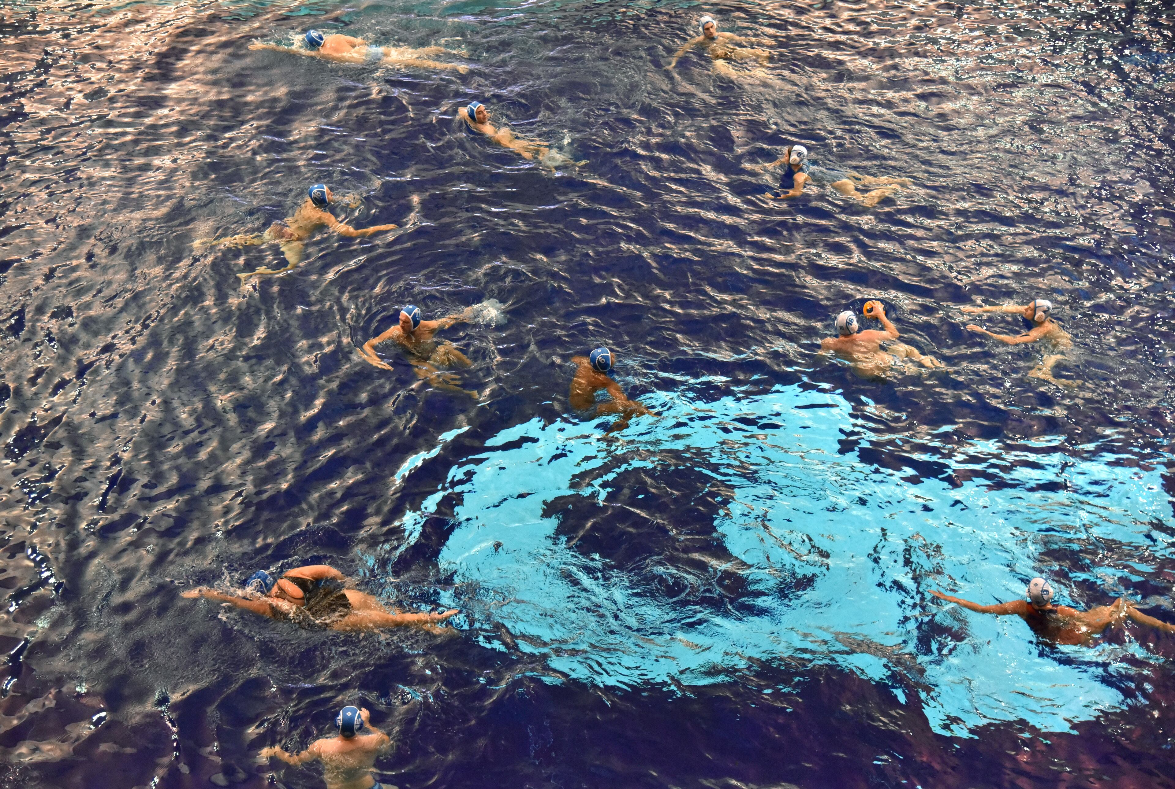 Members of Rainbow Trout Water Polo team play a mini game during practice. (Hyosub Shin / Hyosub.Shin@ajc.com)