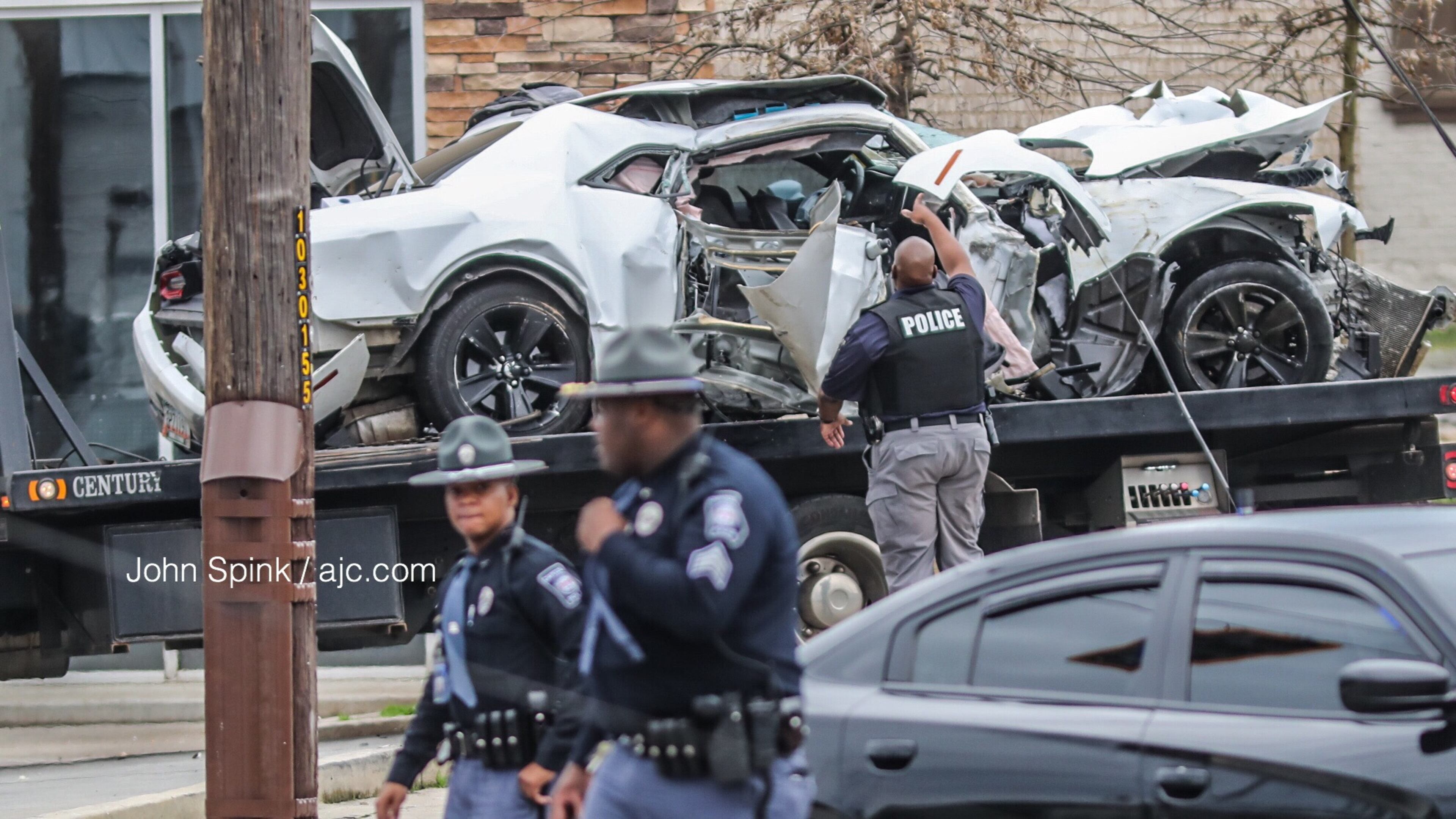 Atlanta fire crews investigated a wreck at the intersection of Northside Drive and Whitehall Street. Officials say the crash took out two power poles and traffic lights.