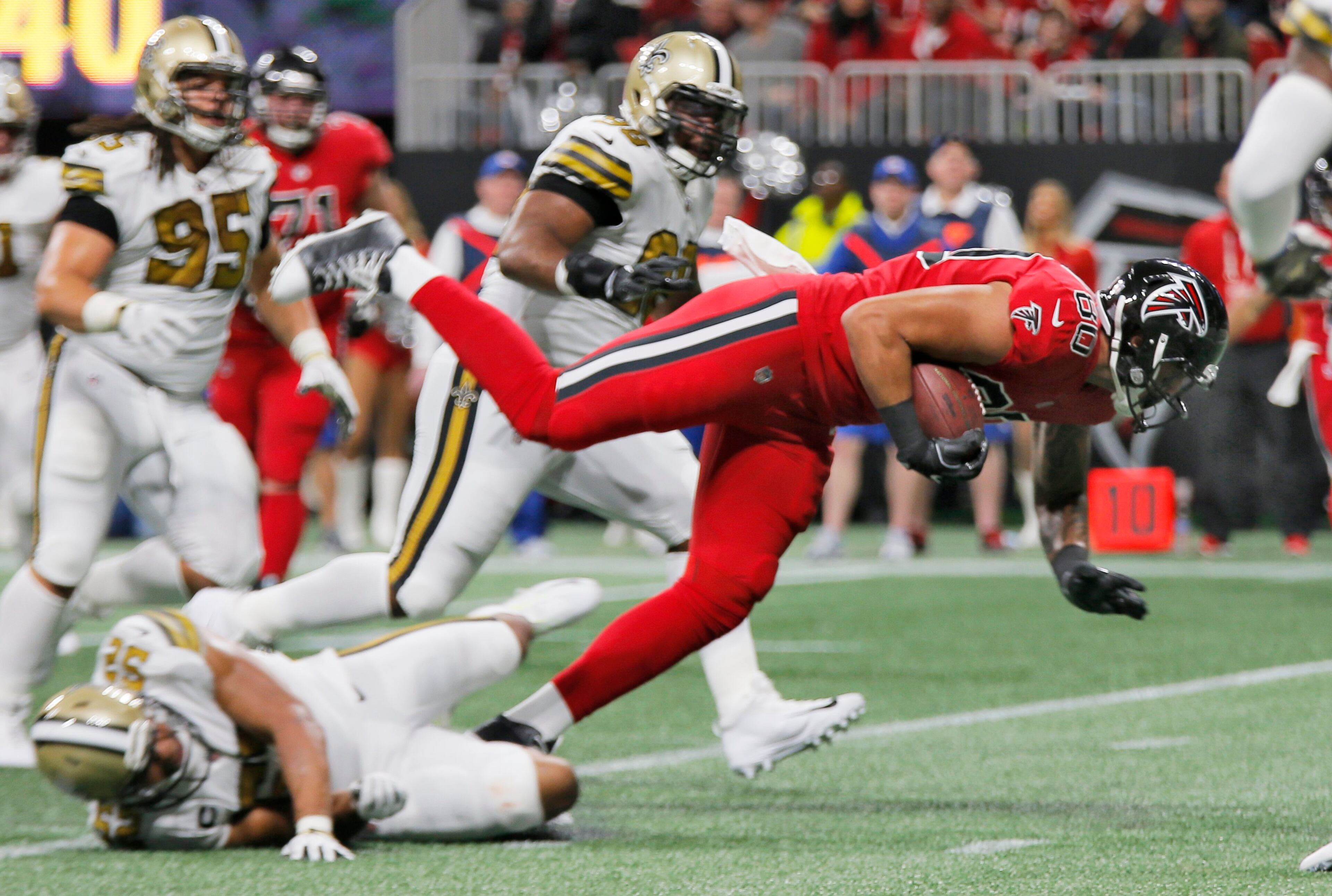 12/7/17 - Atlanta - Atlanta Falcons tight end Levine Toilolo (80) extends a catch near the end of the second quarter that lead to a Falcons TD. Atlanta Falcons play their rival, the New Orleans Saints in an NFL football game at Mercedes-Benz Stadium in Atlanta. BOB ANDRES /BANDRES@AJC.COM