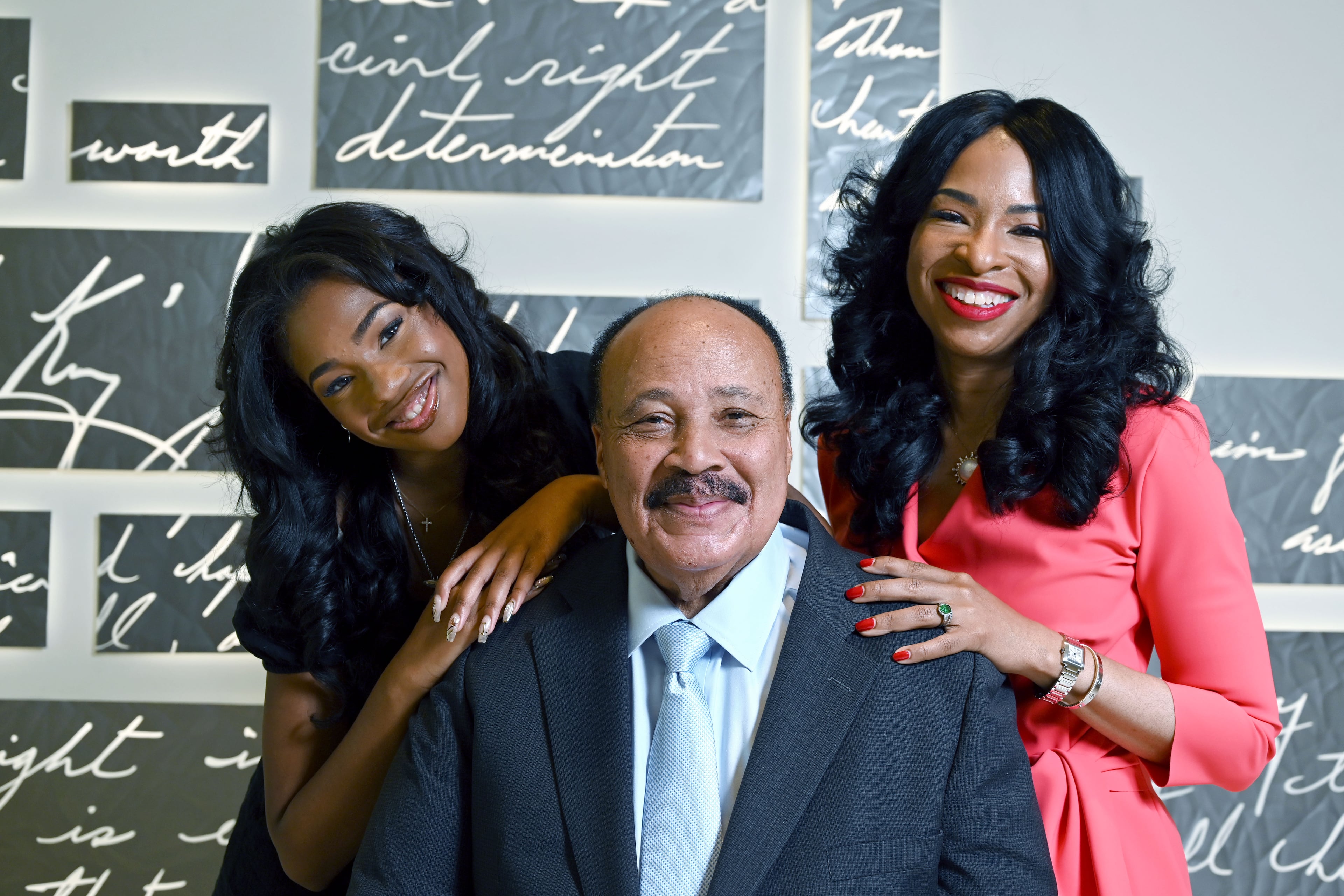 The King family — Martin Luther King III, wife Arndrea Waters King and daughter Yolanda Renee King — pose for a portrait at the National Center for Civil and Human Rights on Friday, June 12, 2026, in Atlanta. (Hyosub Shin/AJC)