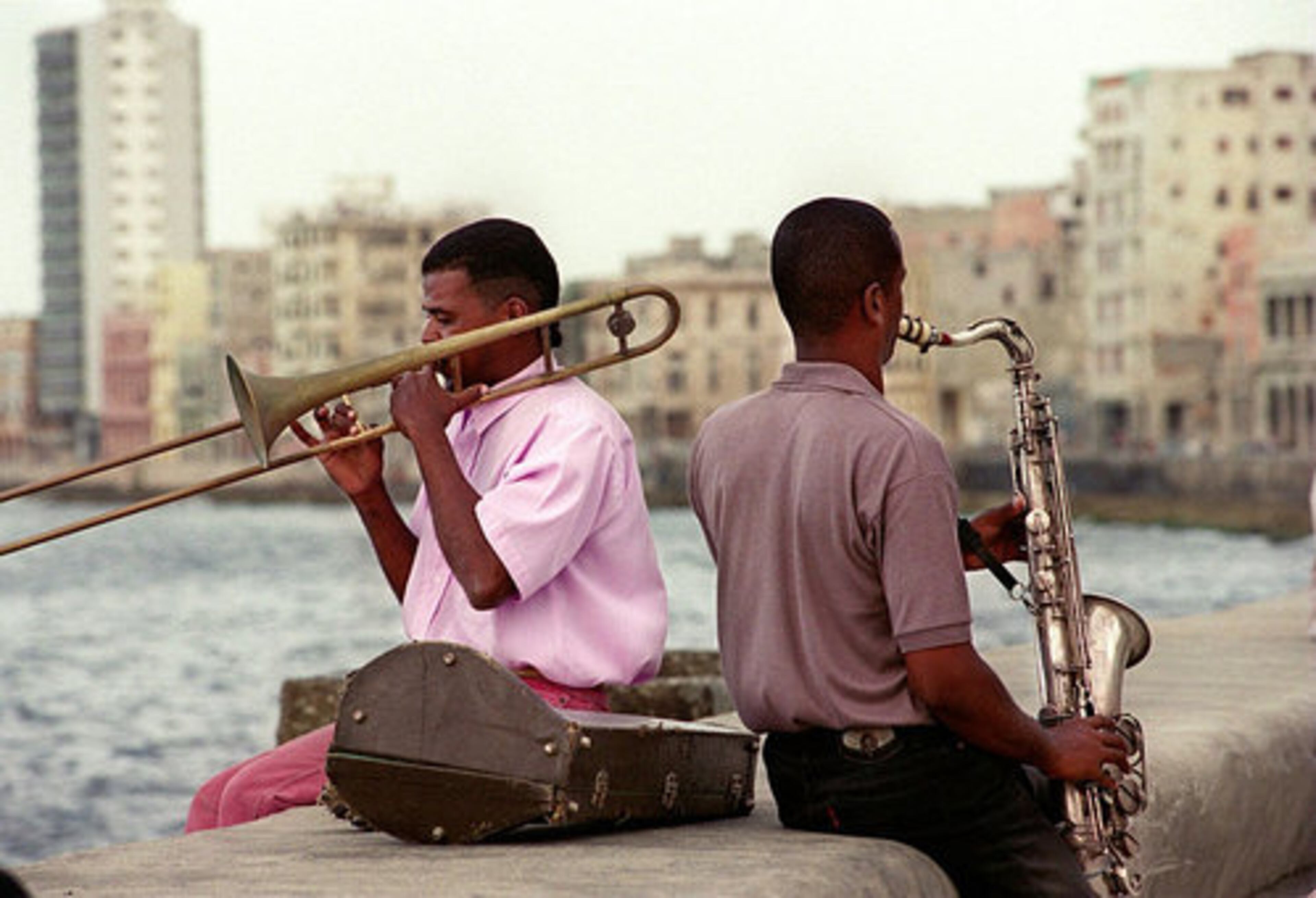 Cubans love their music and the Malecon is a favorite spot to practice tunes. Erin Garcia Atencio on the saxophone and Felix Martinez Borero on the trombone say the ocean provides them good sound quality and a pleasant place to practice. Friends of the two musicians appeared with the Buena Vista Social Club, a popular Cuban band that garnered accolades around the world.