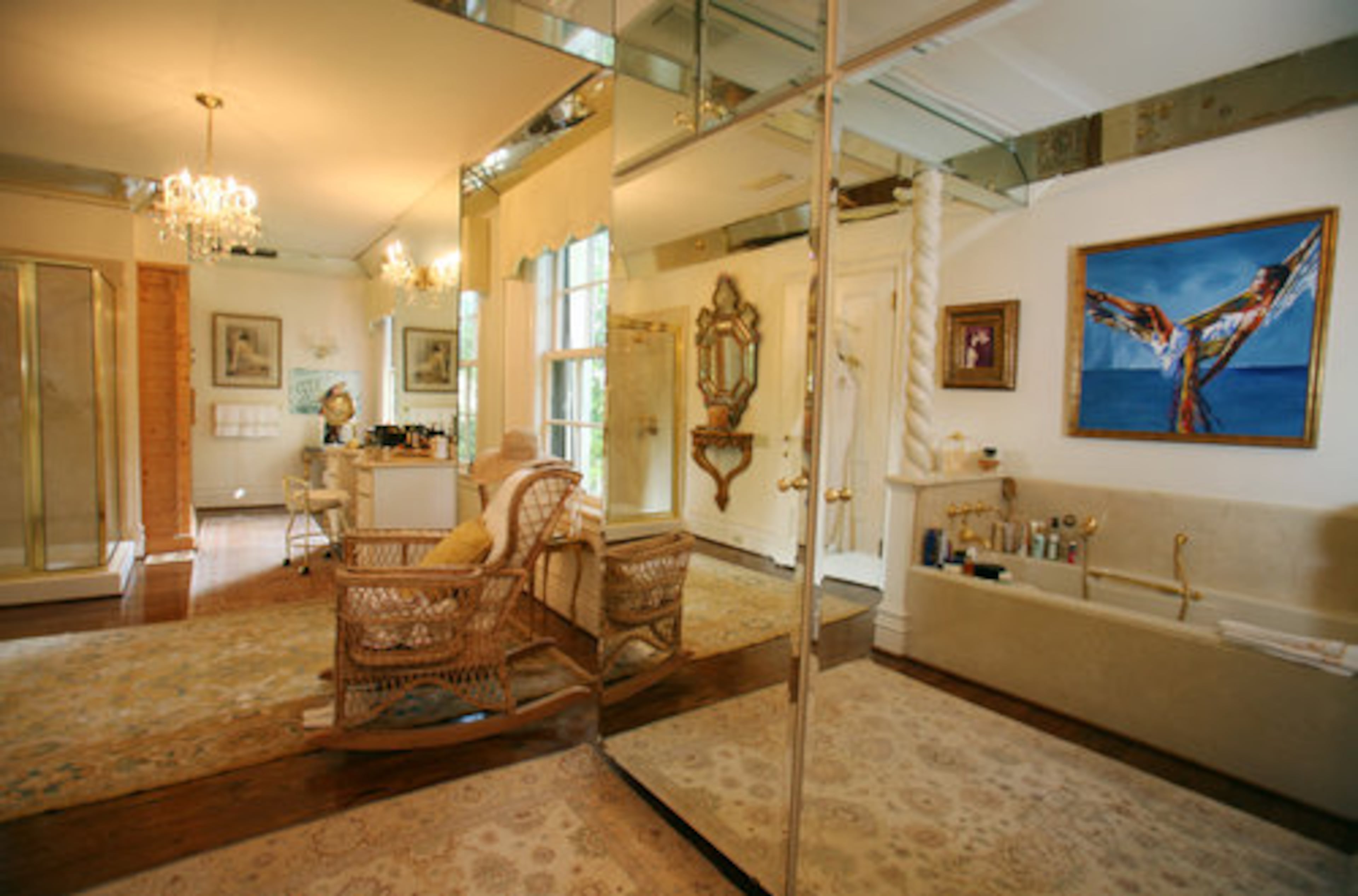 The roomy master bath includes an alluring portrait Rolf painted of Alexandra in the rich colors he favored. Many of Rolf's paintings hang throughout the house, most of them depicting Alexandra or a beautiful woman who resembles her in some aspect.